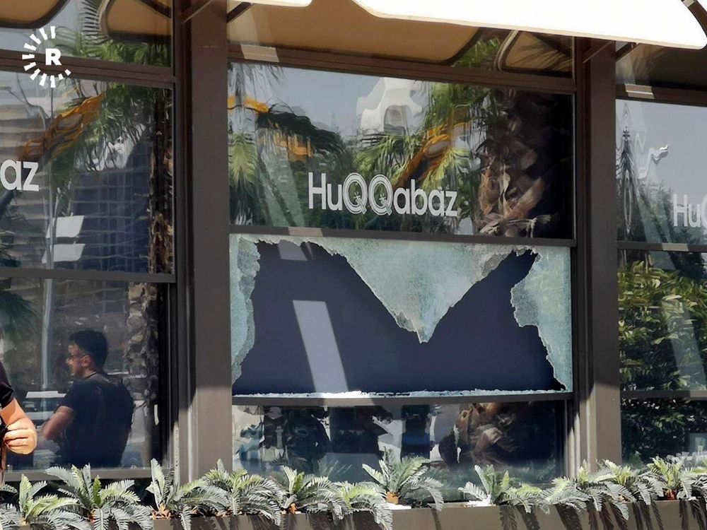 This image posted by RUDAW Facebook TV, an Irbil-based Kurdish broadcaster, shows broken glass shows in the window of a restaurant that was the scene of a shooting, in Irbil, Iraq, Wednesday, July 17, 2019. Turkey's state-run news agency says a Turkish diplomat working at Ankara's consulate in the northern Iraqi city of Irbil was killed during a shooting attack inside the restaurant there. (RUDAW Facebook TV via AP) This image posted by RUDAW Facebook TV, an Irbil-based Kurdish broadcaster, shows broken glass shows in the window of a restaurant that was the scene of a shooting, in Irbil, Iraq, Wednesday, July 17, 2019. Turkey's state-run news agency says a Turkish diplomat working at Ankara's consulate in the northern Iraqi city of Irbil was killed during a shooting attack inside the restaurant there. (RUDAW Facebook TV via AP)