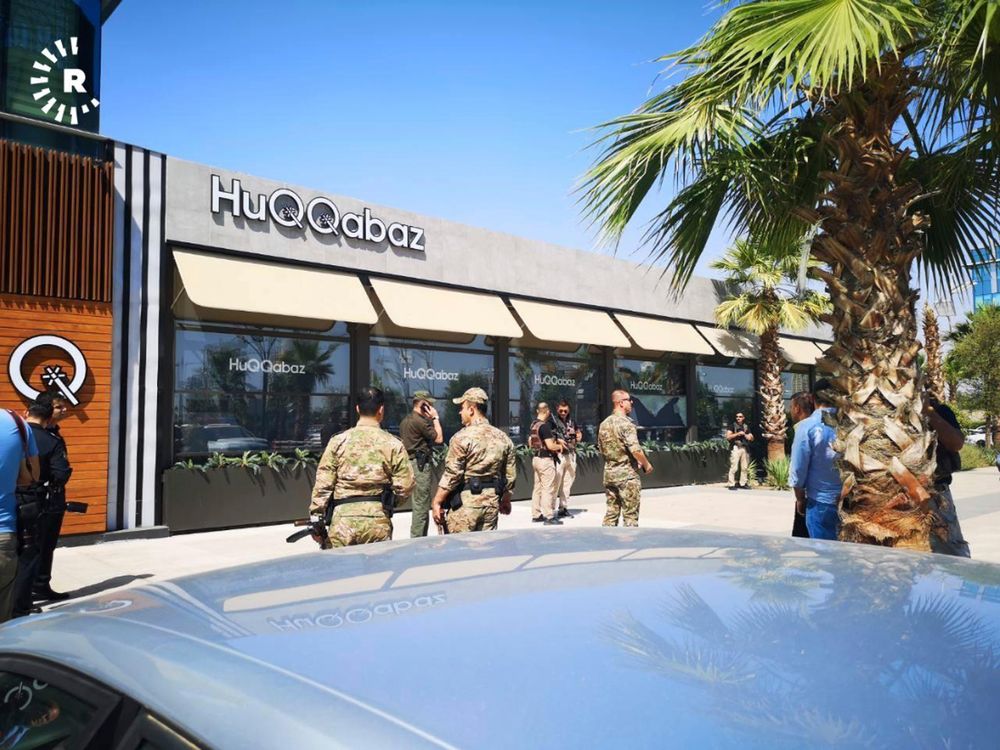 This image posted by RUDAW Facebook TV, an Irbil-based Kurdish broadcaster, shows security forces at the scene of a shooting outside a restaurant in Irbil, Iraq, Wednesday, July 17, 2019. Turkey's state-run news agency says a Turkish diplomat working at Ankara's consulate in the northern Iraqi city of Irbil was killed during a shooting attack inside the restaurant there. (RUDAW Facebook TV via AP) This image posted by RUDAW Facebook TV, an Irbil-based Kurdish broadcaster, shows security forces at the scene of a shooting outside a restaurant in Irbil, Iraq, Wednesday, July 17, 2019. Turkey's state-run news agency says a Turkish diplomat working at Ankara's consulate in the northern Iraqi city of Irbil was killed during a shooting attack inside the restaurant there. (RUDAW Facebook TV via AP)