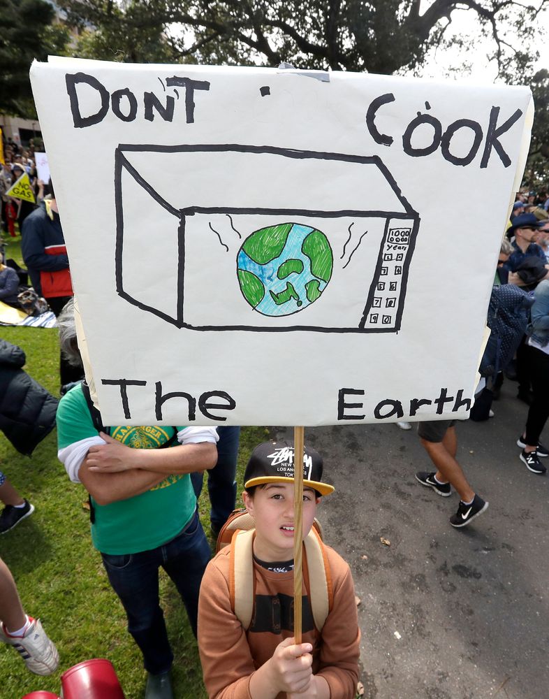A young activist holds up a handmade placard as thousands of protestors, many of them school students, gather in Sydney, Friday, Sept. 20, 2019, calling for action to guard against climate change. Australia's acting Prime Minister Michael McCormack has described ongoing climate rallies as A young activist holds up a handmade placard as thousands of protestors, many of them school students, gather in Sydney, Friday, Sept. 20, 2019, calling for action to guard against climate change. Australia's acting Prime Minister Michael McCormack has described ongoing climate rallies as