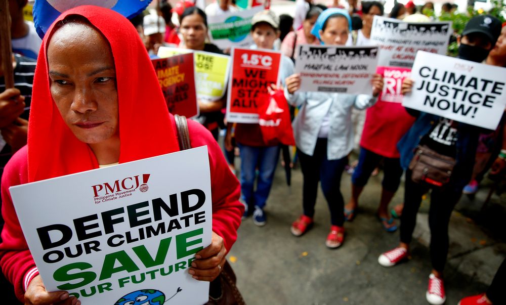 Environmental activists hold placards during a rally outside the Department of Environment and Natural Resources to coincide with the global protests on climate change Friday, Sept. 20, 2019 at suburban Quezon city, northeast of Manila, Philippines. Various environmental groups in the country are participating in what is expected to be the world's largest mobilization on climate change known as Environmental activists hold placards during a rally outside the Department of Environment and Natural Resources to coincide with the global protests on climate change Friday, Sept. 20, 2019 at suburban Quezon city, northeast of Manila, Philippines. Various environmental groups in the country are participating in what is expected to be the world's largest mobilization on climate change known as