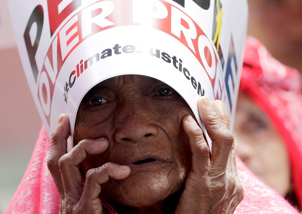 An environmental activist holds a placard during a rally outside the Department of Environment and Natural Resources to coincide with the global protests on climate change Friday, Sept. 20, 2019 at suburban Quezon city, northeast of Manila, Philippines. Various environmental groups in the country are participating in what is expected to be the world's largest mobilization on climate change known as An environmental activist holds a placard during a rally outside the Department of Environment and Natural Resources to coincide with the global protests on climate change Friday, Sept. 20, 2019 at suburban Quezon city, northeast of Manila, Philippines. Various environmental groups in the country are participating in what is expected to be the world's largest mobilization on climate change known as