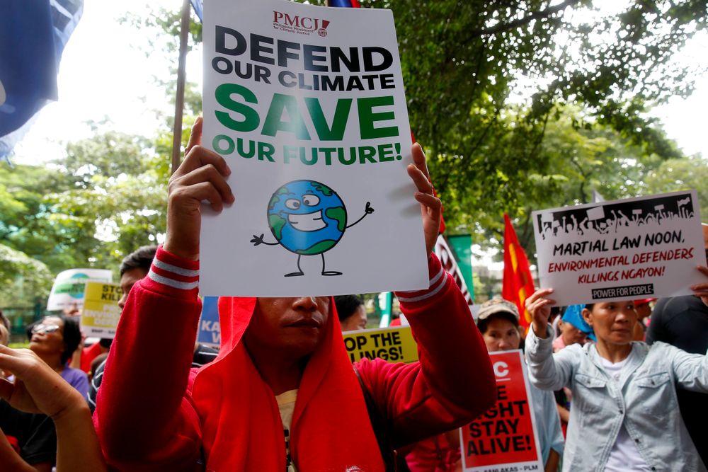 Environmental activists hold placards during a rally outside the Department of Environment and Natural Resources to coincide with the global protests on climate change Friday, Sept. 20, 2019 at suburban Quezon city, northeast of Manila, Philippines. Various environmental groups in the country are participating in what is expected to be the world's largest mobilization on climate change known as Environmental activists hold placards during a rally outside the Department of Environment and Natural Resources to coincide with the global protests on climate change Friday, Sept. 20, 2019 at suburban Quezon city, northeast of Manila, Philippines. Various environmental groups in the country are participating in what is expected to be the world's largest mobilization on climate change known as