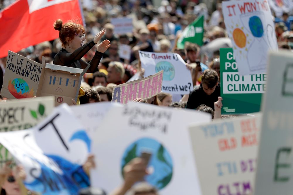 A woman is lifted above the crowd as thousands of protestors, many of them school students, gather in Sydney, Friday, Sept. 20, 2019, calling for action to guard against climate change. Australia's acting Prime Minister Michael McCormack has described ongoing climate rallies as A woman is lifted above the crowd as thousands of protestors, many of them school students, gather in Sydney, Friday, Sept. 20, 2019, calling for action to guard against climate change. Australia's acting Prime Minister Michael McCormack has described ongoing climate rallies as