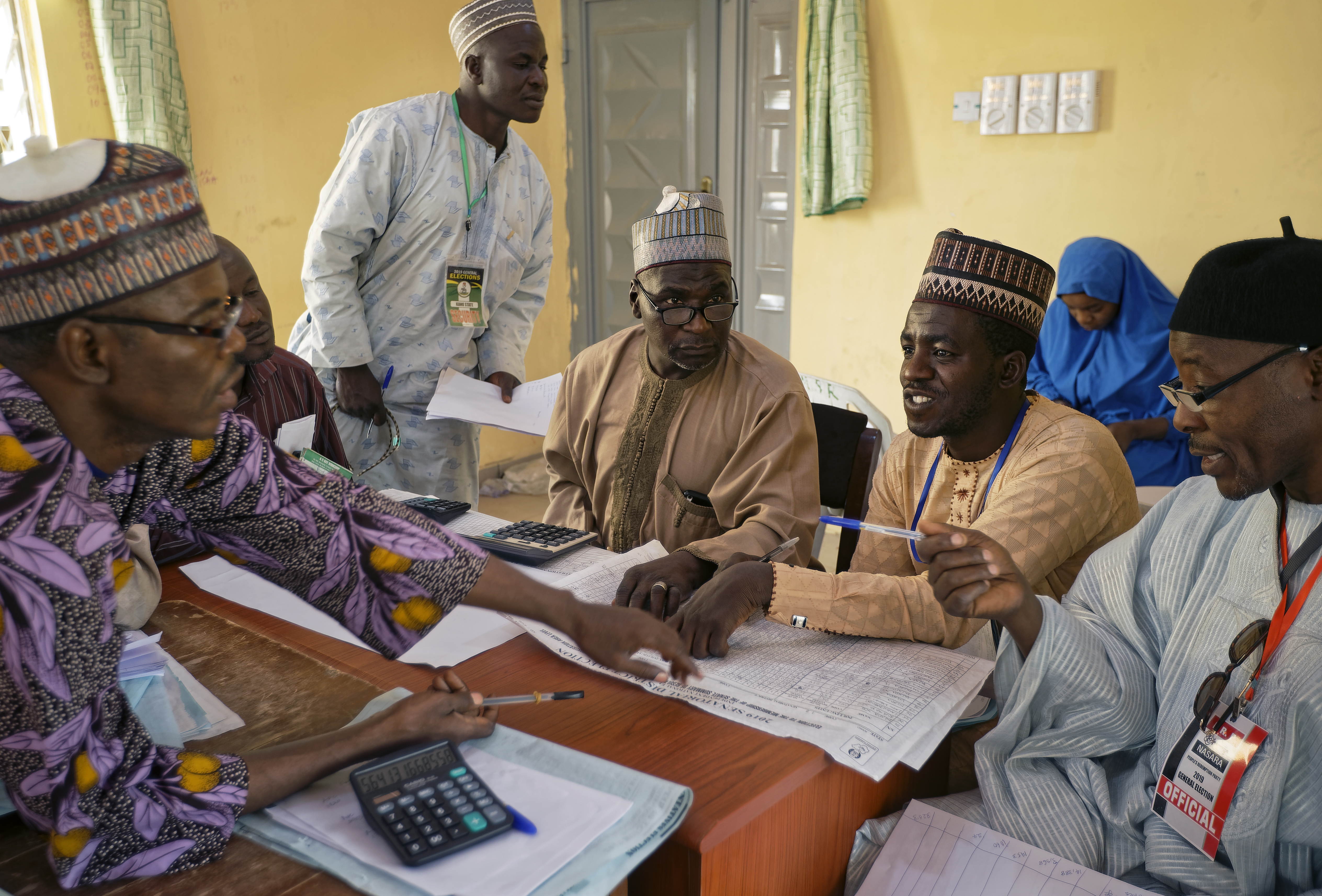 Electoral officials compile voting results at a collation center in Kano, northern Nigeria Sunday, Feb. 24, 2019. Vote counting continued Sunday as Nigerians awaited the outcome of a presidential poll seen as a tight race between the president and a former vice president. (AP Photo/Ben Curtis) Electoral officials compile voting results at a collation center in Kano, northern Nigeria Sunday, Feb. 24, 2019. Vote counting continued Sunday as Nigerians awaited the outcome of a presidential poll seen as a tight race between the president and a former vice president. (AP Photo/Ben Curtis)