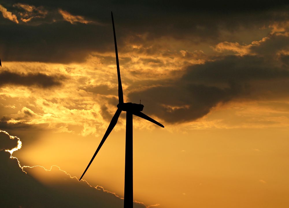 In this June 1, 2017 photo, a wind turbine, which is part of the Lost Creek Wind Farm, is silhouetted against the setting sun near King City, Mo. A new Associated Press-NORC Center for Public Affairs Research poll shows Americans are at least somewhat confident that the world will step up in its fight against global warming. But there are limits to their optimism. People also say their own actions can make a difference. (AP Photo/Charlie Riedel, File) In this June 1, 2017 photo, a wind turbine, which is part of the Lost Creek Wind Farm, is silhouetted against the setting sun near King City, Mo. A new Associated Press-NORC Center for Public Affairs Research poll shows Americans are at least somewhat confident that the world will step up in its fight against global warming. But there are limits to their optimism. People also say their own actions can make a difference. (AP Photo/Charlie Riedel, File)