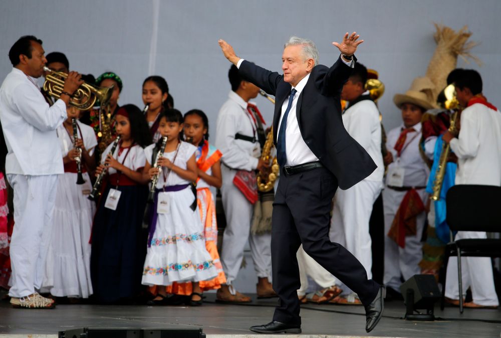 FILE - In this July 1, 2019 file photo, Mexico's President Andres Manuel Lopez Obrador greets supporters as he arrives at a rally to celebrate the one-year anniversary of his election, in Mexico City's main square, the Zocalo. Lopez Obrador's high approval ratings topped 70% in some polls nine months into his term. Many Mexicans are willing to give Lopez Obrador the benefit of the doubt as even the president acknowledges that violent crime is the most serious challenge he faces. (AP Photo/Fernando Llano, File) FILE - In this July 1, 2019 file photo, Mexico's President Andres Manuel Lopez Obrador greets supporters as he arrives at a rally to celebrate the one-year anniversary of his election, in Mexico City's main square, the Zocalo. Lopez Obrador's high approval ratings topped 70% in some polls nine months into his term. Many Mexicans are willing to give Lopez Obrador the benefit of the doubt as even the president acknowledges that violent crime is the most serious challenge he faces. (AP Photo/Fernando Llano, File)