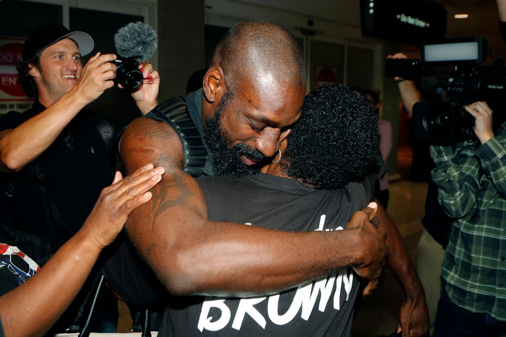 Wendell Brown hugs relatives after his arrival at the Detroit Metropolitan Airport, Wednesday, Sept. 25, 2019, in Romulus, Mich. Brown returned from China where he was imprisoned for his involvement in a bar fight. Brown, a native of Detroit had been teaching English and American football in southwest China when he was arrested in September 2016 and charged with intentional assault. (AP Photo/Carlos Osorio) Wendell Brown hugs relatives after his arrival at the Detroit Metropolitan Airport, Wednesday, Sept. 25, 2019, in Romulus, Mich. Brown returned from China where he was imprisoned for his involvement in a bar fight. Brown, a native of Detroit had been teaching English and American football in southwest China when he was arrested in September 2016 and charged with intentional assault. (AP Photo/Carlos Osorio)