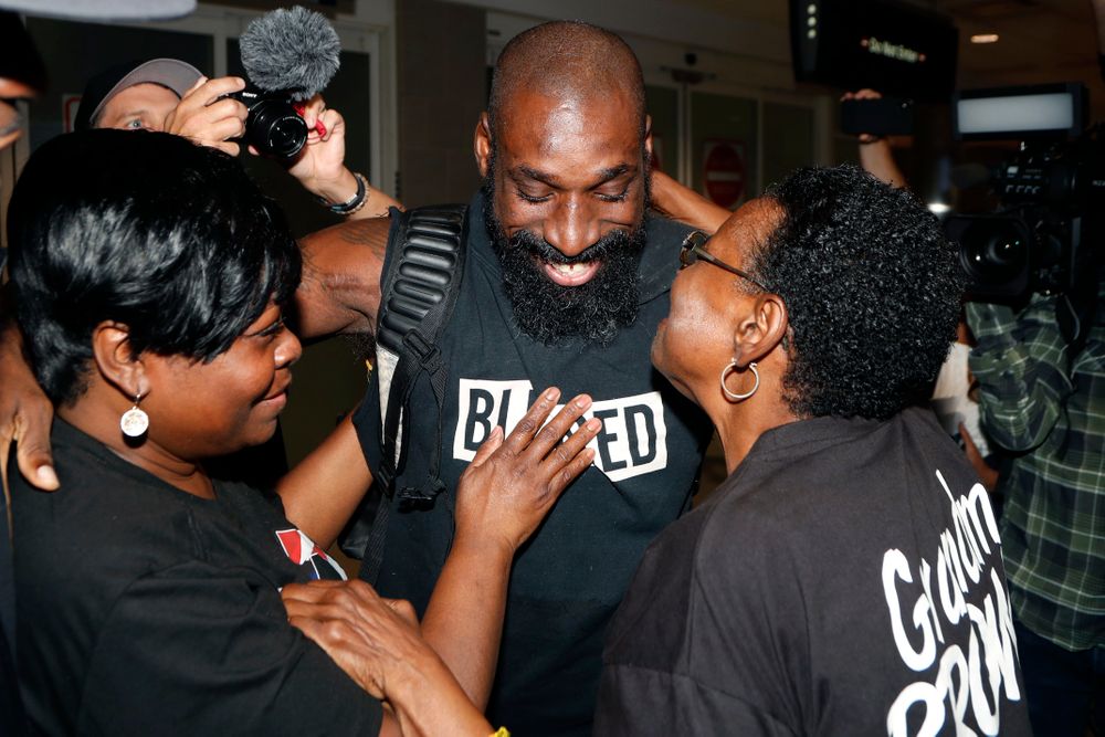 Wendell Brown hugs relatives after his arrival at the Detroit Metropolitan Airport, Wednesday, Sept. 25, 2019, in Romulus, Mich. Brown returned from China where he was imprisoned for his involvement in a bar fight. Brown, a native of Detroit had been teaching English and American football in southwest China when he was arrested in September 2016 and charged with intentional assault. (AP Photo/Carlos Osorio) Wendell Brown hugs relatives after his arrival at the Detroit Metropolitan Airport, Wednesday, Sept. 25, 2019, in Romulus, Mich. Brown returned from China where he was imprisoned for his involvement in a bar fight. Brown, a native of Detroit had been teaching English and American football in southwest China when he was arrested in September 2016 and charged with intentional assault. (AP Photo/Carlos Osorio)