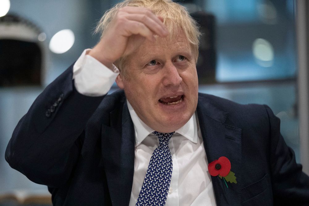 Britain's Prime Minister Boris Johnson gestures, during a visit to Metropolitan Police training college in Hendon, north London, Thursday, Oct. 31,2019. (Aaron Chown/Pool Photo via AP) Britain's Prime Minister Boris Johnson gestures, during a visit to Metropolitan Police training college in Hendon, north London, Thursday, Oct. 31,2019. (Aaron Chown/Pool Photo via AP)