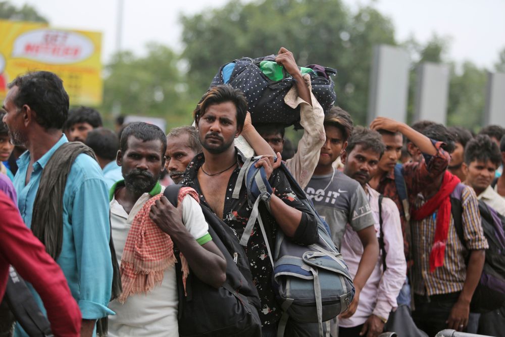 Indian migrant laborers carry their luggage and prepare to leave the region, at a railway station in Jammu, India, Wednesday, Aug. 7, 2019. Indian lawmakers passed a bill Tuesday that strips statehood from the Indian-administered portion of Muslim-majority Kashmir, which remains under an indefinite security lockdown, actions that archrival Pakistan warned could lead to war. (AP Photo/Channi Anand) Indian migrant laborers carry their luggage and prepare to leave the region, at a railway station in Jammu, India, Wednesday, Aug. 7, 2019. Indian lawmakers passed a bill Tuesday that strips statehood from the Indian-administered portion of Muslim-majority Kashmir, which remains under an indefinite security lockdown, actions that archrival Pakistan warned could lead to war. (AP Photo/Channi Anand)