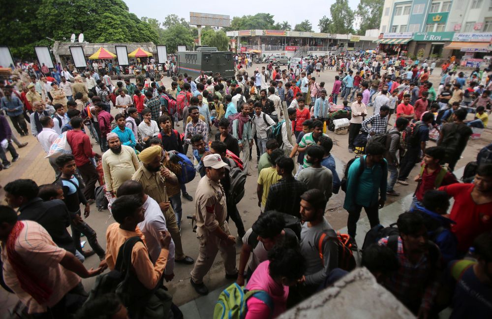 Indian migrant laborers carry their luggage and prepare to leave the region, at a railway station in Jammu, India, Wednesday, Aug. 7, 2019. Indian lawmakers passed a bill Tuesday that strips statehood from the Indian-administered portion of Muslim-majority Kashmir, which remains under an indefinite security lockdown, actions that archrival Pakistan warned could lead to war. (AP Photo/Channi Anand) Indian migrant laborers carry their luggage and prepare to leave the region, at a railway station in Jammu, India, Wednesday, Aug. 7, 2019. Indian lawmakers passed a bill Tuesday that strips statehood from the Indian-administered portion of Muslim-majority Kashmir, which remains under an indefinite security lockdown, actions that archrival Pakistan warned could lead to war. (AP Photo/Channi Anand)