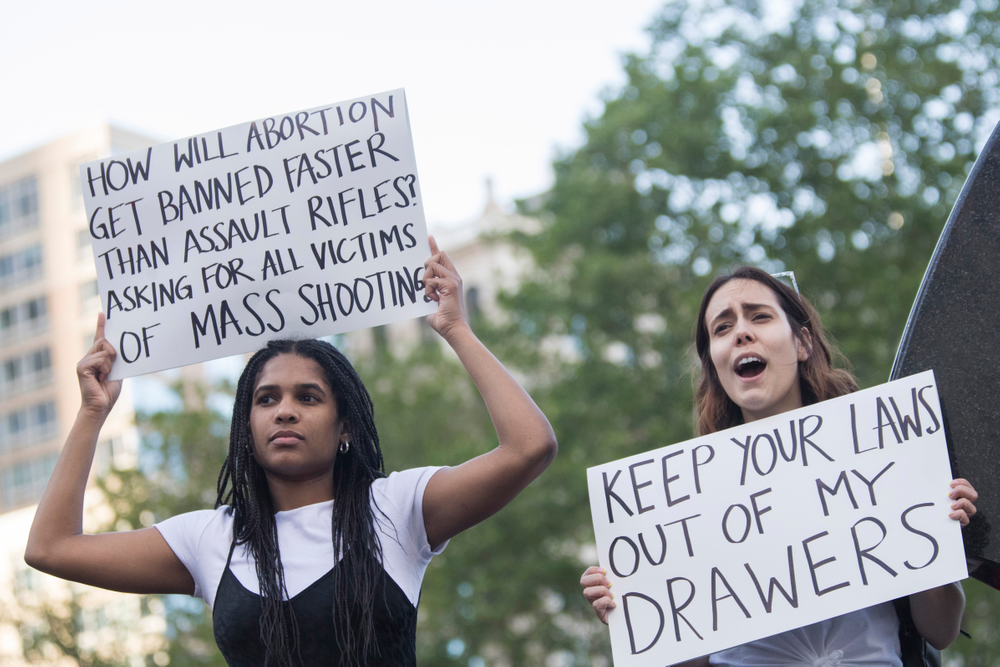 FILE - In this Tuesday, May 21, 2019 file photo, demonstrators in New York hold up signs during a protest against abortion bans enacted in Midwestern and Southern states. Some Democratic-led states are taking steps to enshrine the right to an abortion should the U.S. Supreme Court ever overturn the 1973 Roe v Wade decision. Among them are Nevada, New York and Vermont. (AP Photo/Mary Altaffer) FILE - In this Tuesday, May 21, 2019 file photo, demonstrators in New York hold up signs during a protest against abortion bans enacted in Midwestern and Southern states. Some Democratic-led states are taking steps to enshrine the right to an abortion should the U.S. Supreme Court ever overturn the 1973 Roe v Wade decision. Among them are Nevada, New York and Vermont. (AP Photo/Mary Altaffer)