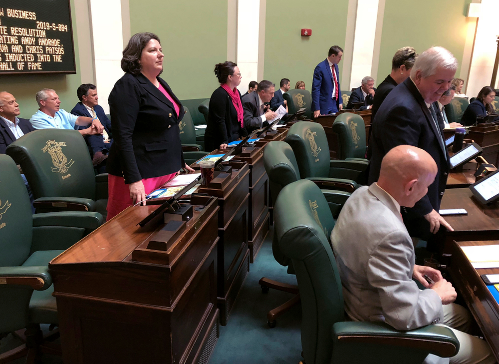 In this Wednesday, May 22, 2019 photo, Democratic state Sen. Dawn Euer, of Newport, R.I., stands during a vote in the Senate chamber at the Statehouse in Providence, R.I. Euer had supported a bill to preserve federal abortion protections in Rhode Island state law, which failed in committee. (AP Photo/Jennifer McDermott) In this Wednesday, May 22, 2019 photo, Democratic state Sen. Dawn Euer, of Newport, R.I., stands during a vote in the Senate chamber at the Statehouse in Providence, R.I. Euer had supported a bill to preserve federal abortion protections in Rhode Island state law, which failed in committee. (AP Photo/Jennifer McDermott)