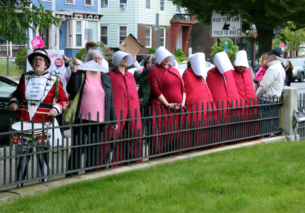 In this Thursday, May 23, 2019, photo, women dressed as characters from the In this Thursday, May 23, 2019, photo, women dressed as characters from the