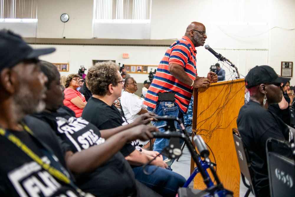 Flint resident Arthur Woodson expresses his anger and disappointment at the podium as the first resident to speak during a community meeting with Flint water prosecutors at UAW Local 659, Friday, June 28, 2019, in Flint, Mich. Michigan Solicitor General Fadwa Hammoud and Wayne County Prosecutor Kym Worthy spoke to about 100 residents at a union hall in the city, two weeks after dismissing charges against the former state health director and other officials. The three-year probe was relaunched, and charges could be refiled. (Jake May/MLive.com/The Flint Journal via AP) Flint resident Arthur Woodson expresses his anger and disappointment at the podium as the first resident to speak during a community meeting with Flint water prosecutors at UAW Local 659, Friday, June 28, 2019, in Flint, Mich. Michigan Solicitor General Fadwa Hammoud and Wayne County Prosecutor Kym Worthy spoke to about 100 residents at a union hall in the city, two weeks after dismissing charges against the former state health director and other officials. The three-year probe was relaunched, and charges could be refiled. (Jake May/MLive.com/The Flint Journal via AP)
