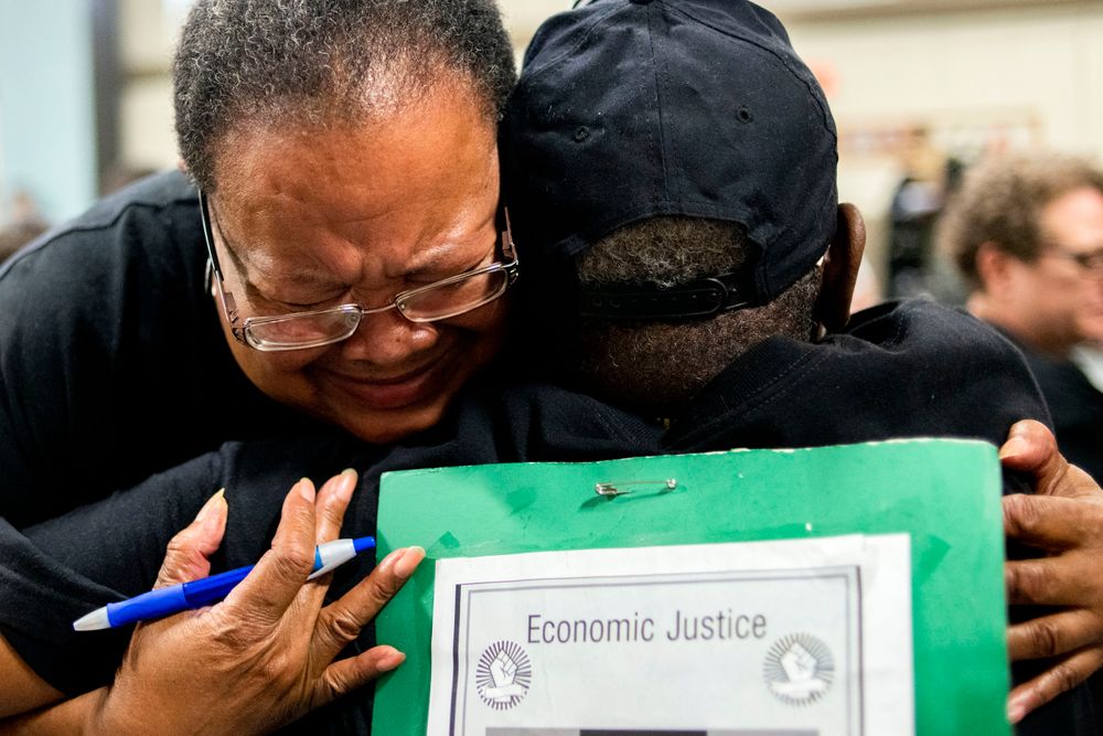 Marijoyce Campbell, a 65-year-old lifelong Flint resident, cries in the arms of a friend after speaking her mind at the podium during a community meeting with Flint water prosecutors at UAW Local 659, Friday, June 28, 2019, in Flint, Mich. Michigan Solicitor General Fadwa Hammoud and Wayne County Prosecutor Kym Worthy spoke to about 100 residents Friday night at a union hall in the city, two weeks after dismissing charges against the former state health director and other officials. (Jake May/MLive.com/The Flint Journal via AP) Marijoyce Campbell, a 65-year-old lifelong Flint resident, cries in the arms of a friend after speaking her mind at the podium during a community meeting with Flint water prosecutors at UAW Local 659, Friday, June 28, 2019, in Flint, Mich. Michigan Solicitor General Fadwa Hammoud and Wayne County Prosecutor Kym Worthy spoke to about 100 residents Friday night at a union hall in the city, two weeks after dismissing charges against the former state health director and other officials. (Jake May/MLive.com/The Flint Journal via AP)