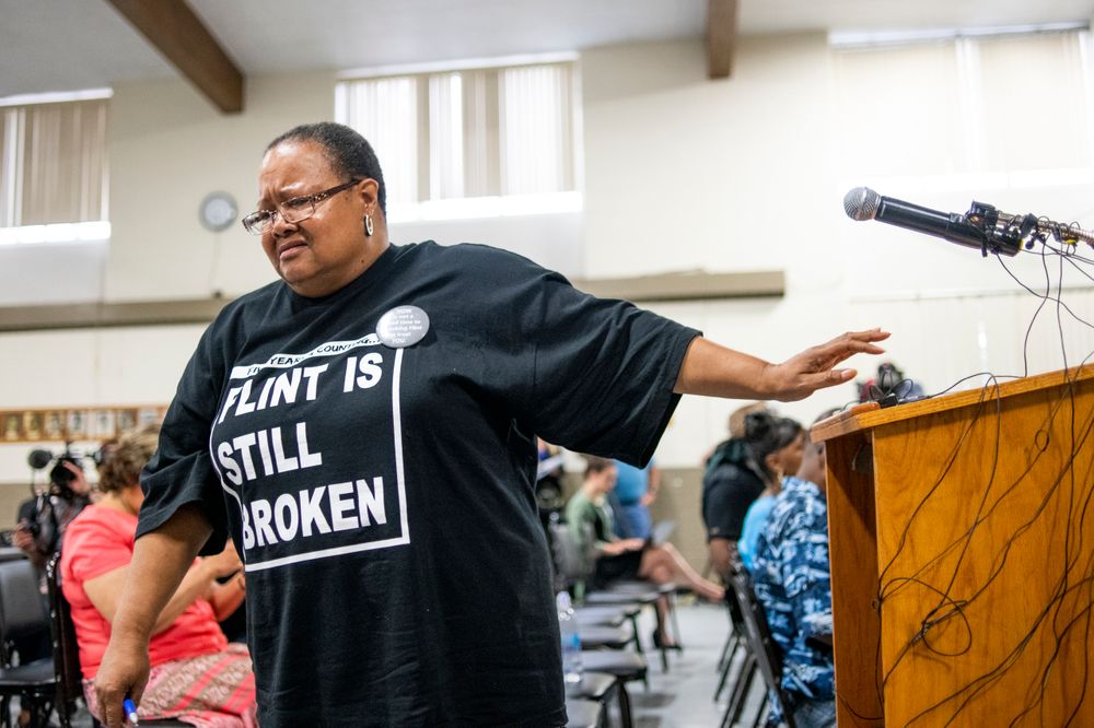 Marijoyce Campbell, a 65-year-old lifelong Flint resident, walks away from the podium in tears after speaking her mind during a community meeting with Flint water prosecutors at UAW Local 659, Friday, June 28, 2019, in Flint, Mich. Campbell said she had a “heavy heart” after learning of the new documents and that some materials the previous investigative team had were heavily redacted. Michigan Solicitor General Fadwa Hammoud and Wayne County Prosecutor Kym Worthy spoke to about 100 residents at the union hall, two weeks after dismissing charges. (Jake May/MLive.com/The Flint Journal via AP) Marijoyce Campbell, a 65-year-old lifelong Flint resident, walks away from the podium in tears after speaking her mind during a community meeting with Flint water prosecutors at UAW Local 659, Friday, June 28, 2019, in Flint, Mich. Campbell said she had a “heavy heart” after learning of the new documents and that some materials the previous investigative team had were heavily redacted. Michigan Solicitor General Fadwa Hammoud and Wayne County Prosecutor Kym Worthy spoke to about 100 residents at the union hall, two weeks after dismissing charges. (Jake May/MLive.com/The Flint Journal via AP)