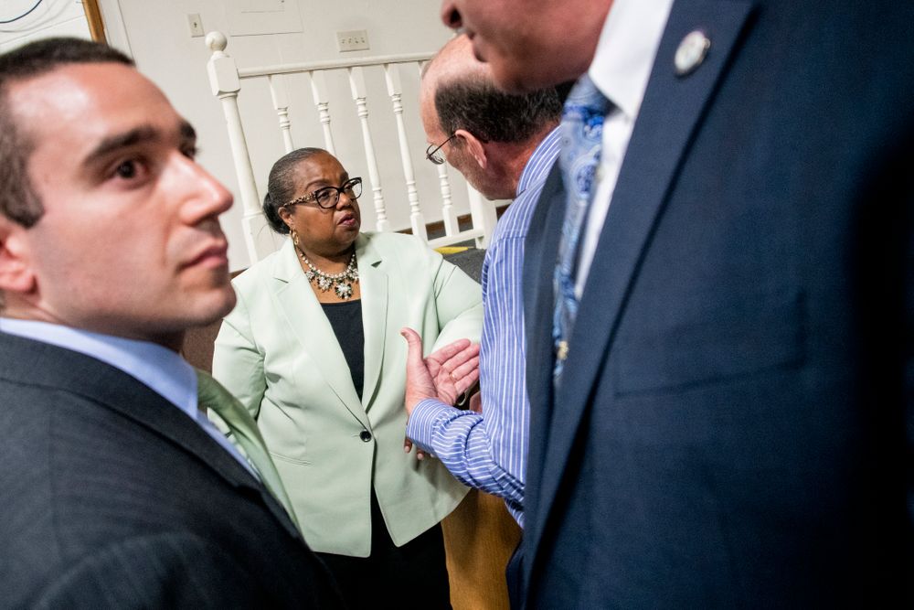 Wayne County Prosecutor Kym Worthy speaks with an area resident after a community meeting with Flint water prosecutors at UAW Local 659 on Friday, June 28, 2019, in Flint, Mich., two weeks after dismissing the charges in the criminal cases. Prosecutors who dropped charges against eight people in the Flint water scandal explained their decision in a public forum Friday night, telling frustrated and shocked residents they must look at hundreds of mobile devices and millions of documents that a previous investigative team never reviewed. (Jake May/MLive.com/The Flint Journal via AP) Wayne County Prosecutor Kym Worthy speaks with an area resident after a community meeting with Flint water prosecutors at UAW Local 659 on Friday, June 28, 2019, in Flint, Mich., two weeks after dismissing the charges in the criminal cases. Prosecutors who dropped charges against eight people in the Flint water scandal explained their decision in a public forum Friday night, telling frustrated and shocked residents they must look at hundreds of mobile devices and millions of documents that a previous investigative team never reviewed. (Jake May/MLive.com/The Flint Journal via AP)