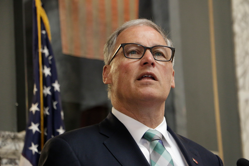 FILE - In this Monday, May 13, 2019, file photo, Washington Gov. Jay Inslee speaks in Olympia, Wash. Washington has become the latest West Coast state to enact broad sanctuary protections that restrict all local authorities from asking about people's immigration status. Inslee signed the measure Tuesday, May 21, 2019, implementing the new rules. (AP Photo/Rachel La Corte, File) FILE - In this Monday, May 13, 2019, file photo, Washington Gov. Jay Inslee speaks in Olympia, Wash. Washington has become the latest West Coast state to enact broad sanctuary protections that restrict all local authorities from asking about people's immigration status. Inslee signed the measure Tuesday, May 21, 2019, implementing the new rules. (AP Photo/Rachel La Corte, File)