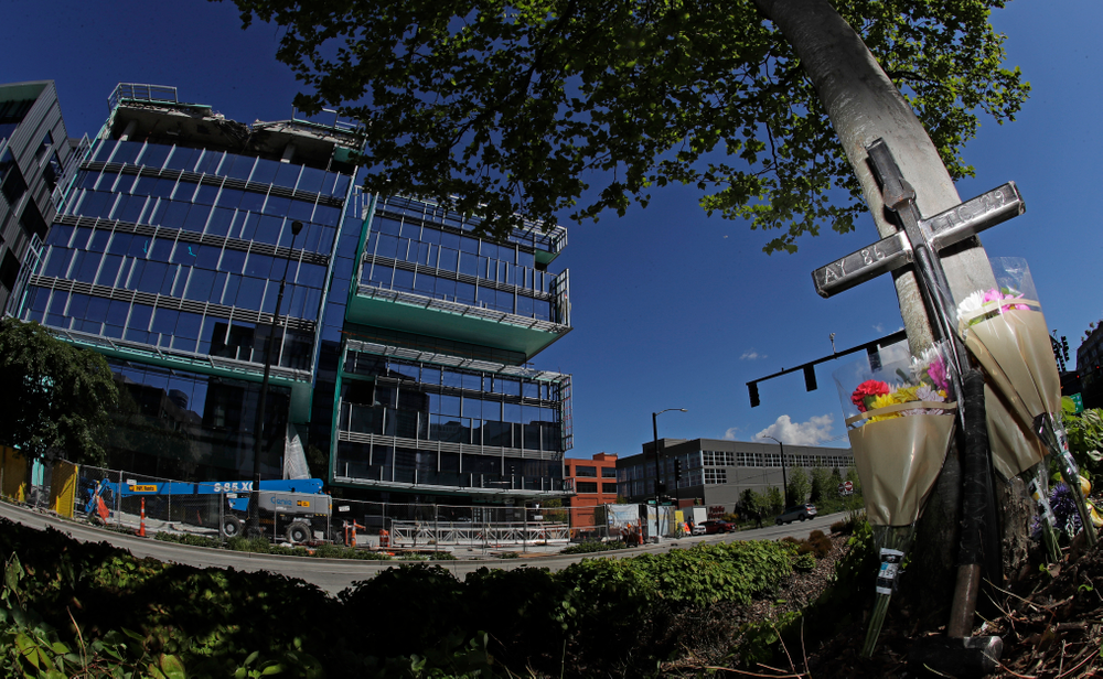 An iron cross bearing the numbers of Ironworkers Local union chapters from Portland and Seattle stands next to flowers, Monday, April 29, 2019, at a memorial on a median across the street from where a construction crane collapsed and fell Saturday, killing four people, two of whom were ironworkers. (AP Photo/Ted S. Warren) An iron cross bearing the numbers of Ironworkers Local union chapters from Portland and Seattle stands next to flowers, Monday, April 29, 2019, at a memorial on a median across the street from where a construction crane collapsed and fell Saturday, killing four people, two of whom were ironworkers. (AP Photo/Ted S. Warren)