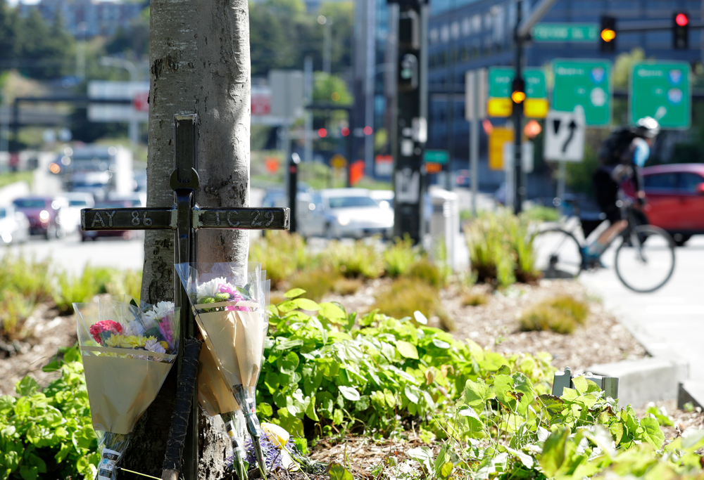 An iron cross bearing the numbers of Ironworkers Local union chapters from Portland and Seattle stands next to flowers, Monday, April 29, 2019, in Seattle at a memorial on a median across the street from where a construction crane collapsed and fell Saturday, killing four people, two of whom were ironworkers. (AP Photo/Ted S. Warren) An iron cross bearing the numbers of Ironworkers Local union chapters from Portland and Seattle stands next to flowers, Monday, April 29, 2019, in Seattle at a memorial on a median across the street from where a construction crane collapsed and fell Saturday, killing four people, two of whom were ironworkers. (AP Photo/Ted S. Warren)