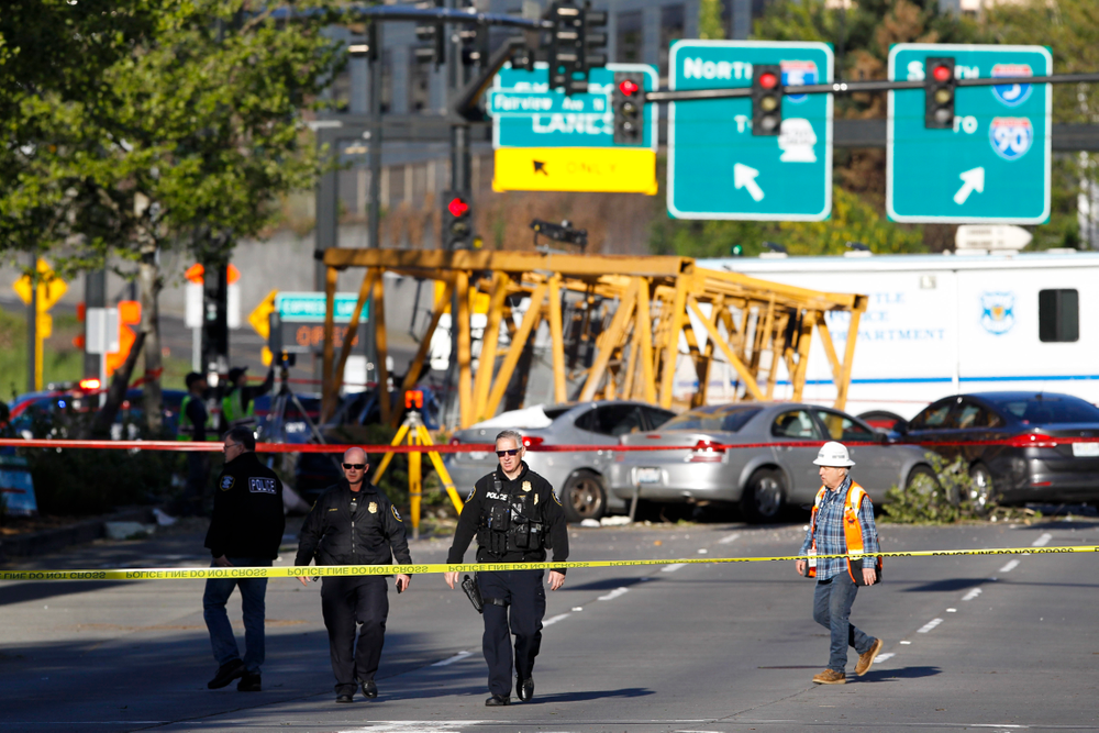 Emergency crews work at the scene of a construction crane collapse where several people were killed and others were injured Saturday, April 27, 2019, in the South Lake Union neighborhood of Seattle. The crane collapsed near the intersection of Mercer Street and Fairview Avenue pinning cars underneath it near Interstate 5 shortly after 3 p.m. (AP Photo/Joe Nicholson) Emergency crews work at the scene of a construction crane collapse where several people were killed and others were injured Saturday, April 27, 2019, in the South Lake Union neighborhood of Seattle. The crane collapsed near the intersection of Mercer Street and Fairview Avenue pinning cars underneath it near Interstate 5 shortly after 3 p.m. (AP Photo/Joe Nicholson)