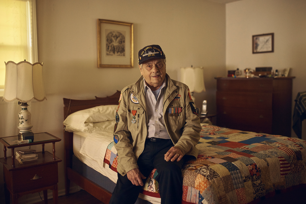 In this May 14, 2019, photo, World War II U.S. veteran Frank DeVita, who took part in the D-Day battle, poses for a picture at his home in Bridgewater, N.J. This June he’ll make his 12th trip back to Normandy. He likes to bring people with him so they’ll know what happened there. (AP Photo/Andres Kudacki) In this May 14, 2019, photo, World War II U.S. veteran Frank DeVita, who took part in the D-Day battle, poses for a picture at his home in Bridgewater, N.J. This June he’ll make his 12th trip back to Normandy. He likes to bring people with him so they’ll know what happened there. (AP Photo/Andres Kudacki)