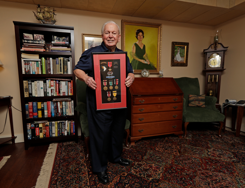 In this Wednesday, May 22, 2019, photo, D-Day veteran Eugene Deibler poses for a photo with his medals from WWII at his home in Charlotte, N.C. “How many people remember the Civil War? How many people will remember World War I? And now it's the same with World War II,” he said. “World War II will fade away also.” (AP Photo/Chuck Burton) In this Wednesday, May 22, 2019, photo, D-Day veteran Eugene Deibler poses for a photo with his medals from WWII at his home in Charlotte, N.C. “How many people remember the Civil War? How many people will remember World War I? And now it's the same with World War II,” he said. “World War II will fade away also.” (AP Photo/Chuck Burton)