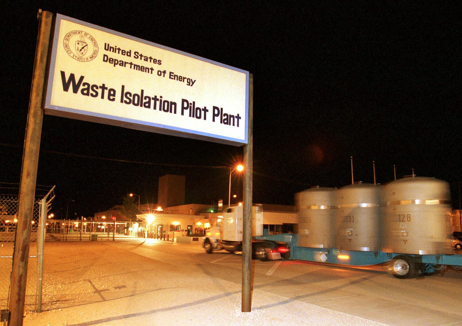 FILE - The first load of nuclear waste arrives in this March 26, 1999 file photo, at the Waste Isolation Pilot Plant (WIPP) site in Carlsbad, N.M., from Los Alamos National Laboratory. Twenty years and more than 12,380 shipments later, tons of Cold War-era waste from decades of bomb-making and nuclear research across the U.S. have been stashed in the salt caverns that make up the underground facility. (AP Photo/Thomas Herbert) FILE - The first load of nuclear waste arrives in this March 26, 1999 file photo, at the Waste Isolation Pilot Plant (WIPP) site in Carlsbad, N.M., from Los Alamos National Laboratory. Twenty years and more than 12,380 shipments later, tons of Cold War-era waste from decades of bomb-making and nuclear research across the U.S. have been stashed in the salt caverns that make up the underground facility. (AP Photo/Thomas Herbert)