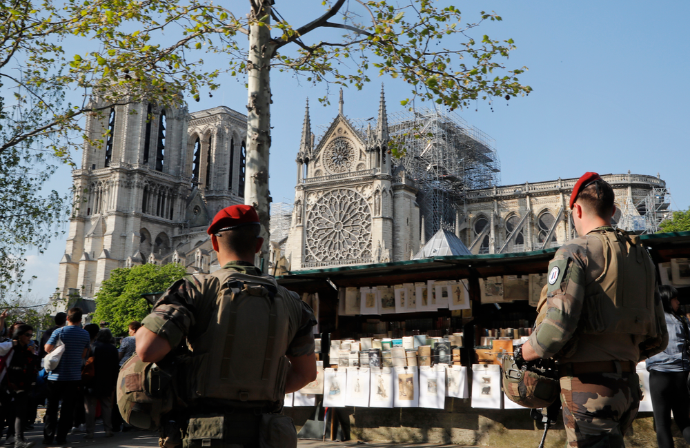 French soldiers patrol along the Notre Dame Cathedral in Paris, Friday, April 19, 2019. Rebuilding Notre Dame, the 800-year-old Paris cathedral devastated by fire this week, will cost billions of dollars as architects, historians and artisans work to preserve the medieval landmark. (AP Photo/Michel Euler) French soldiers patrol along the Notre Dame Cathedral in Paris, Friday, April 19, 2019. Rebuilding Notre Dame, the 800-year-old Paris cathedral devastated by fire this week, will cost billions of dollars as architects, historians and artisans work to preserve the medieval landmark. (AP Photo/Michel Euler)