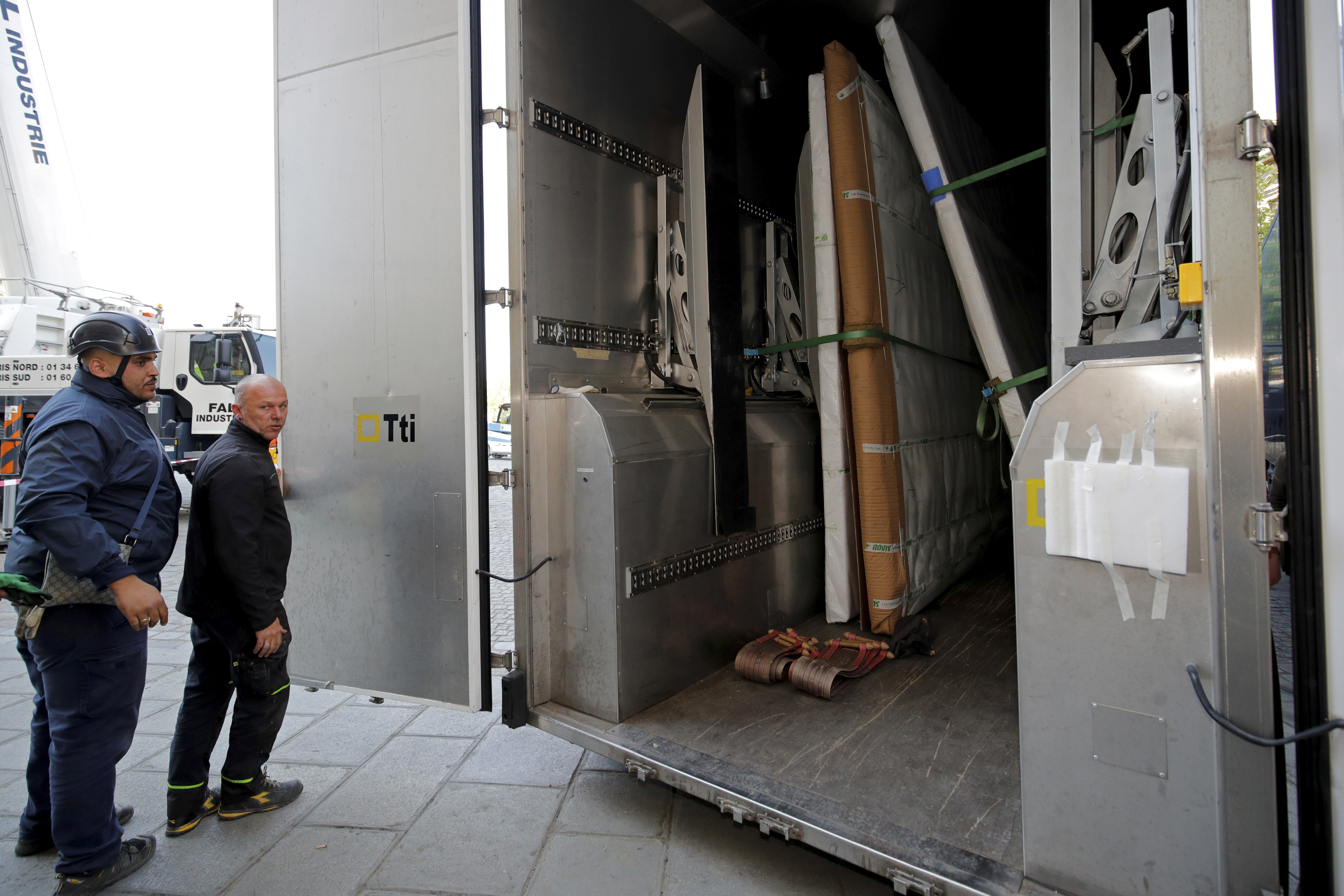 Large artworks are seen in a truck after being removed from Notre-Dame Cathedral to be secured after a massive fire devastated large parts of the gothic cathedral in Paris, Friday, April 19, 2019. Rebuilding Notre Dame, the 800-year-old Paris cathedral devastated by fire this week, will cost billions of dollars as architects, historians and artisans work to preserve the medieval landmark. (Philippe Wojazer/Pool via AP) Large artworks are seen in a truck after being removed from Notre-Dame Cathedral to be secured after a massive fire devastated large parts of the gothic cathedral in Paris, Friday, April 19, 2019. Rebuilding Notre Dame, the 800-year-old Paris cathedral devastated by fire this week, will cost billions of dollars as architects, historians and artisans work to preserve the medieval landmark. (Philippe Wojazer/Pool via AP)
