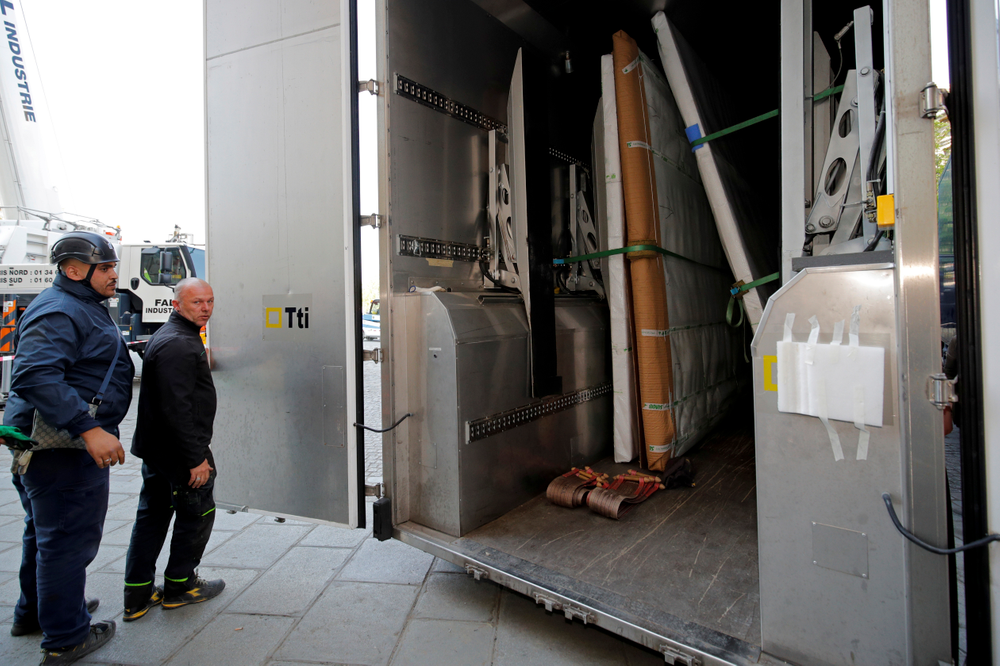 Large artworks are seen in a truck after being removed from Notre-Dame Cathedral to be secured after a massive fire devastated large parts of the gothic cathedral in Paris, Friday, April 19, 2019. Rebuilding Notre Dame, the 800-year-old Paris cathedral devastated by fire this week, will cost billions of dollars as architects, historians and artisans work to preserve the medieval landmark. (Philippe Wojazer/Pool via AP) Large artworks are seen in a truck after being removed from Notre-Dame Cathedral to be secured after a massive fire devastated large parts of the gothic cathedral in Paris, Friday, April 19, 2019. Rebuilding Notre Dame, the 800-year-old Paris cathedral devastated by fire this week, will cost billions of dollars as architects, historians and artisans work to preserve the medieval landmark. (Philippe Wojazer/Pool via AP)