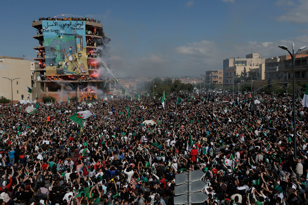 Demonstrators light flares during a protest in Bordj Bou Arreridj, east of Algiers, Friday, April 26, 2019. Algerians are massing for a 10th week of protests against their country's ruling class, calling for the ex-president's brother to be put on trial. (AP Photo/Toufik Doudou) Demonstrators light flares during a protest in Bordj Bou Arreridj, east of Algiers, Friday, April 26, 2019. Algerians are massing for a 10th week of protests against their country's ruling class, calling for the ex-president's brother to be put on trial. (AP Photo/Toufik Doudou)