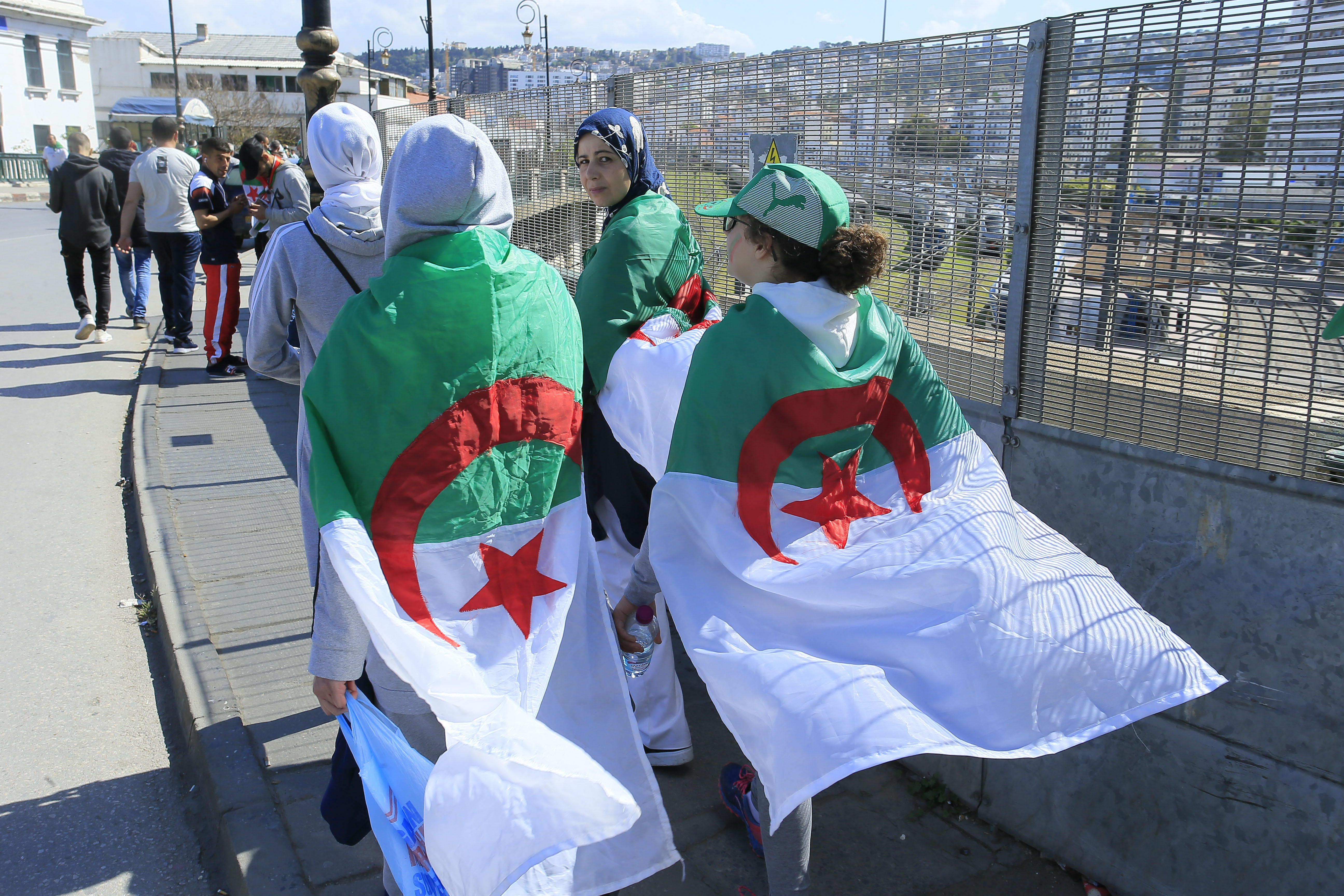 Women wear the Algerian flag during a protest in Algiers, Friday, April 26, 2019. Algerians are massing for a 10th week of protests against their country's ruling class, calling for the ex-president's brother to be put on trial. (AP Photo/Anis Belghoul) Women wear the Algerian flag during a protest in Algiers, Friday, April 26, 2019. Algerians are massing for a 10th week of protests against their country's ruling class, calling for the ex-president's brother to be put on trial. (AP Photo/Anis Belghoul)