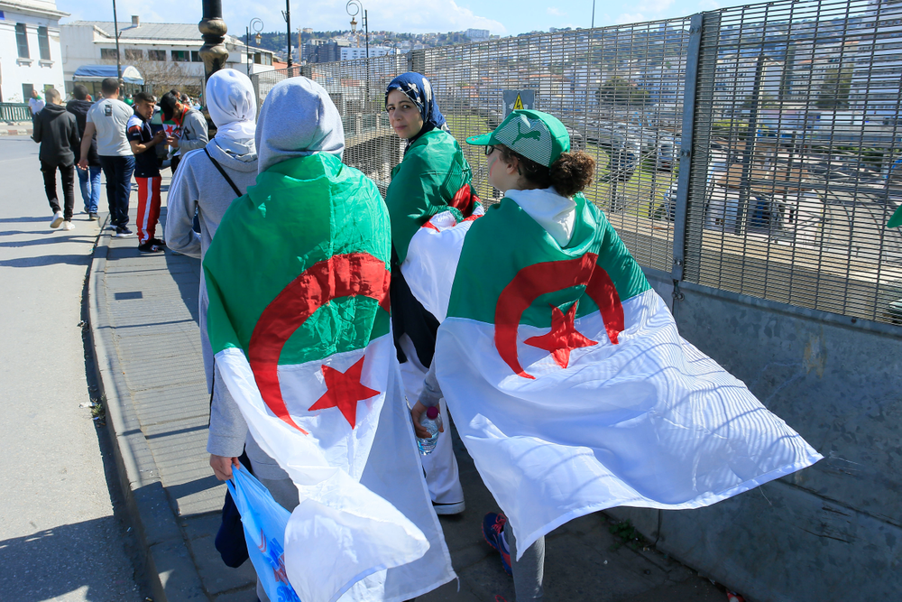 Women wear the Algerian flag during a protest in Algiers, Friday, April 26, 2019. Algerians are massing for a 10th week of protests against their country's ruling class, calling for the ex-president's brother to be put on trial. (AP Photo/Anis Belghoul) Women wear the Algerian flag during a protest in Algiers, Friday, April 26, 2019. Algerians are massing for a 10th week of protests against their country's ruling class, calling for the ex-president's brother to be put on trial. (AP Photo/Anis Belghoul)