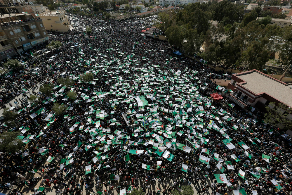 Demonstrators hold Algerian flags during a protest in Bordj Bou Arreridj, east of Algiers, Friday, April 26, 2019. Algerians are massing for a 10th week of protests against their country's ruling class, calling for the ex-president's brother to be put on trial. (AP Photo/Toufik Doudou) Demonstrators hold Algerian flags during a protest in Bordj Bou Arreridj, east of Algiers, Friday, April 26, 2019. Algerians are massing for a 10th week of protests against their country's ruling class, calling for the ex-president's brother to be put on trial. (AP Photo/Toufik Doudou)