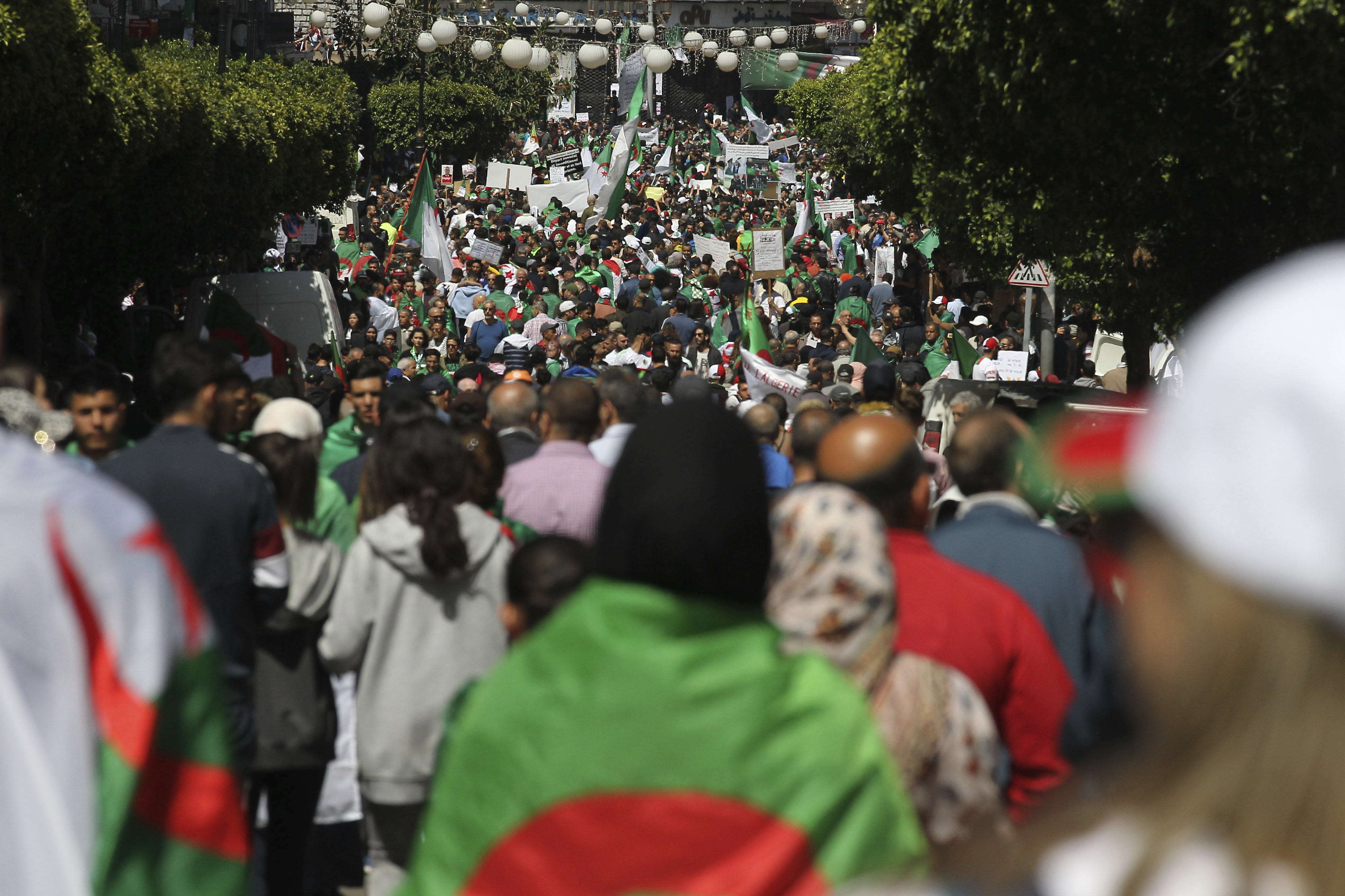 Demonstrators march during a protest in Algiers, Friday, April 26, 2019. Algerians are massing for a 10th week of protests against their country's ruling class, calling for the ex-president's brother to be put on trial. (AP Photo/Fateh Guidoum) Demonstrators march during a protest in Algiers, Friday, April 26, 2019. Algerians are massing for a 10th week of protests against their country's ruling class, calling for the ex-president's brother to be put on trial. (AP Photo/Fateh Guidoum)
