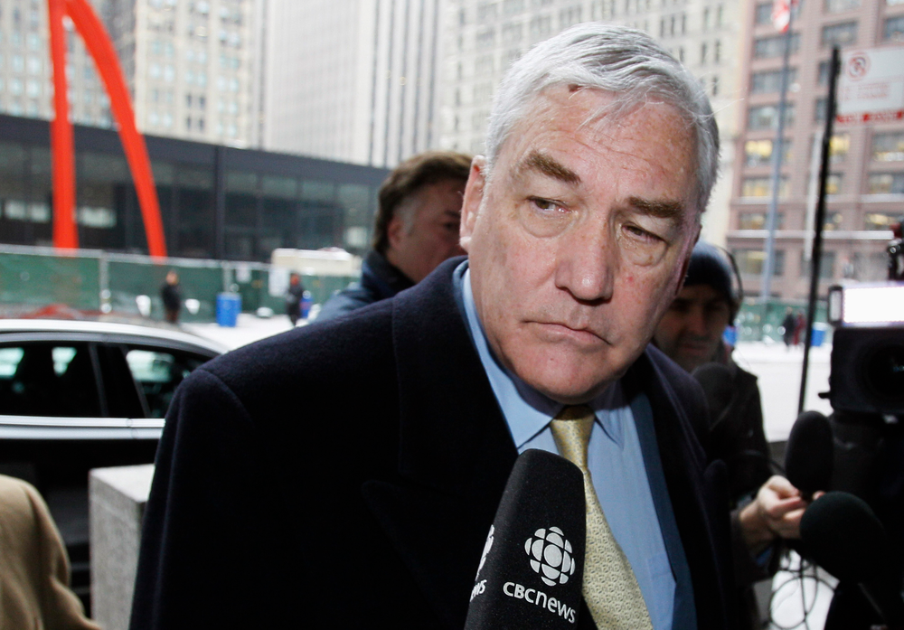 FILE - In this Jan. 13, 2011 file photo, Conrad Black arrives at the federal building in Chicago. President Donald Trump has granted a full pardon to Black, a former newspaper publisher who has written a flattering political biography of Trump. Black's media empire once included the Chicago Sun-Times and The Daily Telegraph of London. (AP Photo/Charles Rex Arbogast, File) FILE - In this Jan. 13, 2011 file photo, Conrad Black arrives at the federal building in Chicago. President Donald Trump has granted a full pardon to Black, a former newspaper publisher who has written a flattering political biography of Trump. Black's media empire once included the Chicago Sun-Times and The Daily Telegraph of London. (AP Photo/Charles Rex Arbogast, File)