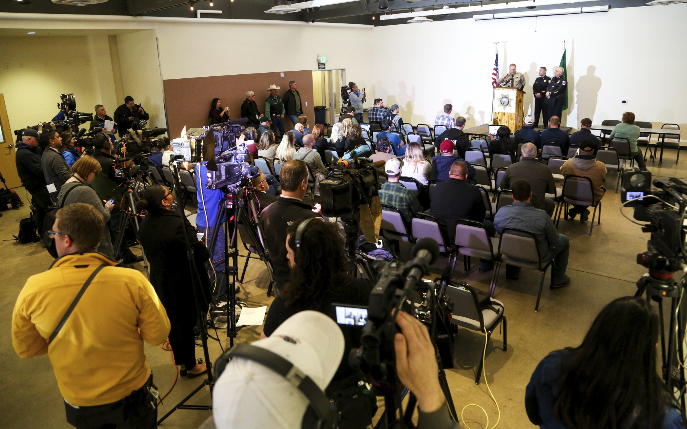 Kittitas County Sheriff Gene Dana speaks at a news conference, Wednesday, March 20, 2019, in Ellensburg, Wash. about the death of Deputy Ryan Thompson, who was killed Tuesday evening when he and a Kittitas Police officer exchanged gunfire with a road-rage driving suspect in Kittitas, Wash. The driver of the vehicle was also shot and later died at a hospital. (Jake Green/The Daily Record via AP) Kittitas County Sheriff Gene Dana speaks at a news conference, Wednesday, March 20, 2019, in Ellensburg, Wash. about the death of Deputy Ryan Thompson, who was killed Tuesday evening when he and a Kittitas Police officer exchanged gunfire with a road-rage driving suspect in Kittitas, Wash. The driver of the vehicle was also shot and later died at a hospital. (Jake Green/The Daily Record via AP)