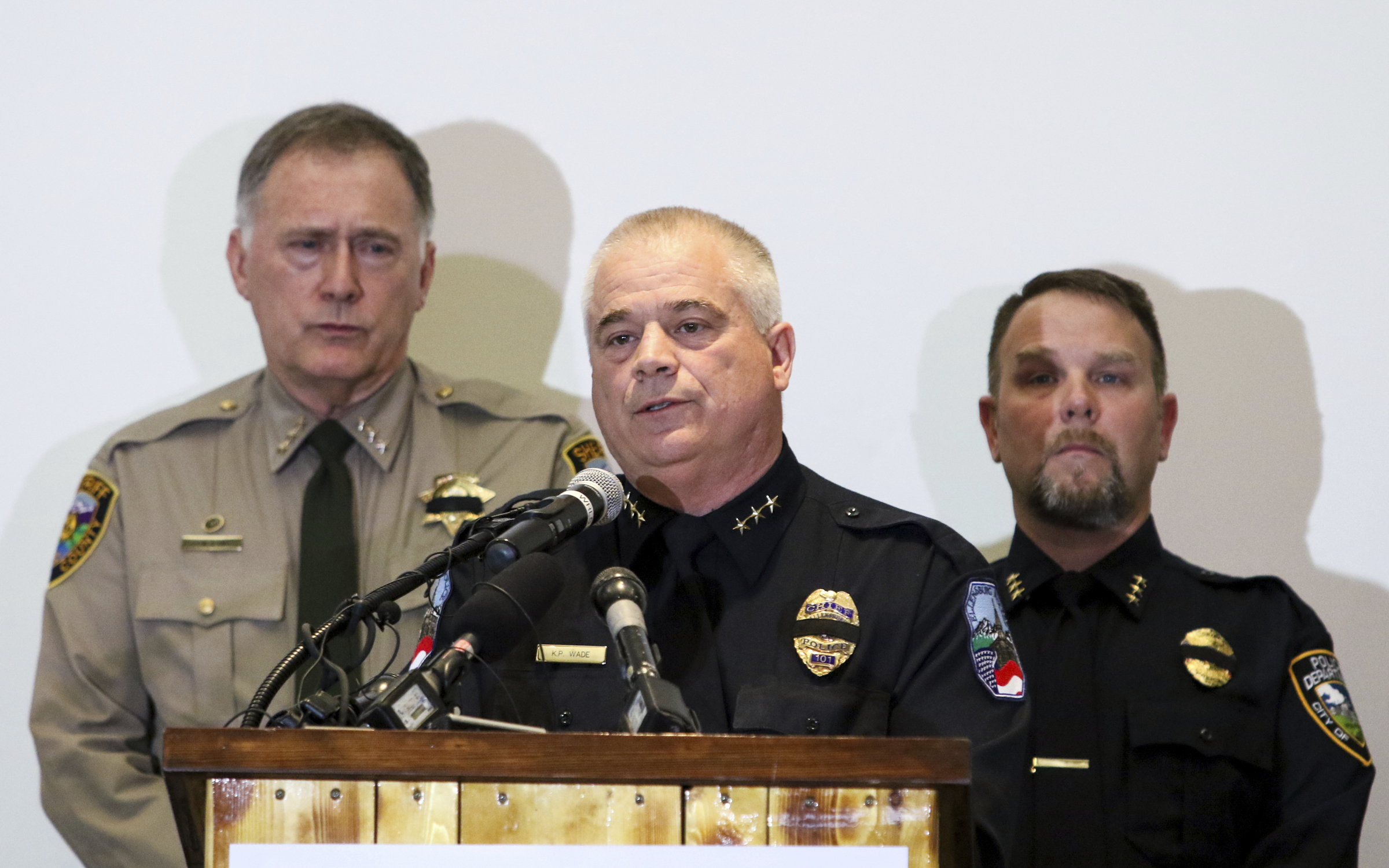 Ellensburg Police Chief Ken Wade, center, talks to reporters as Kittitas County Sheriff Gene Dana, left, and Kittitas Police Chief Chris Taylor, right, look on during a news conference, Wednesday, March 20, 2019, in Ellensburg, Wash. Wade was talking about the death of Deputy Ryan Thompson, who was killed Tuesday evening when he and a Kittitas Police officer exchanged gunfire with a road-rage driving suspect in Kittitas, Wash. The driver of the vehicle was also shot and later died at a hospital. (Jake Green/The Daily Record via AP) Ellensburg Police Chief Ken Wade, center, talks to reporters as Kittitas County Sheriff Gene Dana, left, and Kittitas Police Chief Chris Taylor, right, look on during a news conference, Wednesday, March 20, 2019, in Ellensburg, Wash. Wade was talking about the death of Deputy Ryan Thompson, who was killed Tuesday evening when he and a Kittitas Police officer exchanged gunfire with a road-rage driving suspect in Kittitas, Wash. The driver of the vehicle was also shot and later died at a hospital. (Jake Green/The Daily Record via AP)