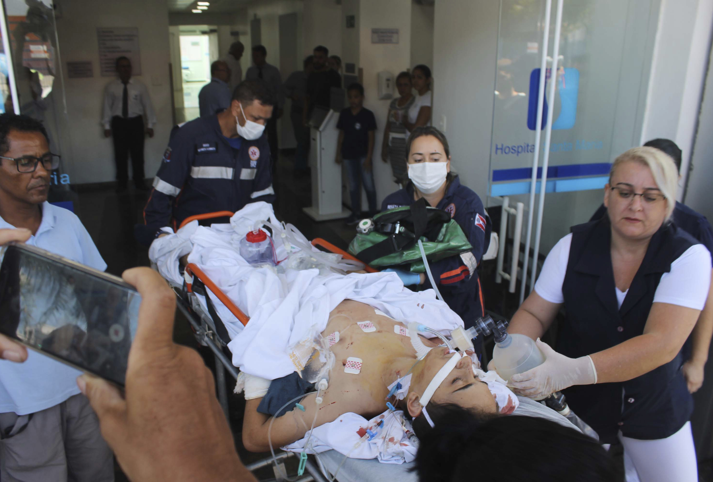 A teenager who was injured during a shooting inside the Raul Brasil State School, is carried on a gurney into a hospital, in Suzano, Brazil, Wednesday, March 13, 2019. The state government of Sao Paulo said two teenagers, armed with guns and wearing hoods, entered the school and began shooting at students. They then killed themselves, according to the statement. (Johnny Morais/Futura Press via AP) A teenager who was injured during a shooting inside the Raul Brasil State School, is carried on a gurney into a hospital, in Suzano, Brazil, Wednesday, March 13, 2019. The state government of Sao Paulo said two teenagers, armed with guns and wearing hoods, entered the school and began shooting at students. They then killed themselves, according to the statement. (Johnny Morais/Futura Press via AP)