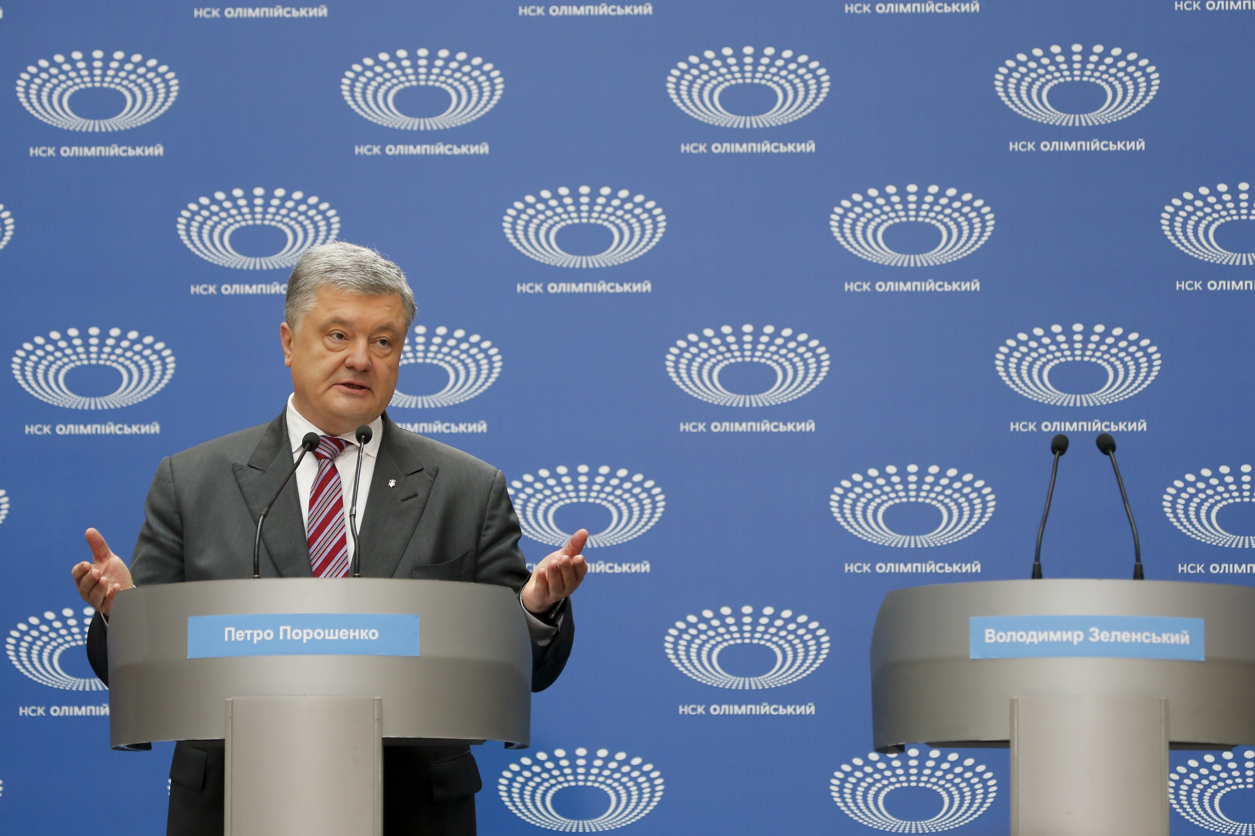 Ukrainian President Petro Poroshenko gestures as he answers to a journalist's question ahead of the presidential elections on April 21, at the Olympic stadium in Kiev, Ukraine, Sunday, April 14, 2019. (AP Photo/Efrem Lukatsky) Ukrainian President Petro Poroshenko gestures as he answers to a journalist's question ahead of the presidential elections on April 21, at the Olympic stadium in Kiev, Ukraine, Sunday, April 14, 2019. (AP Photo/Efrem Lukatsky)