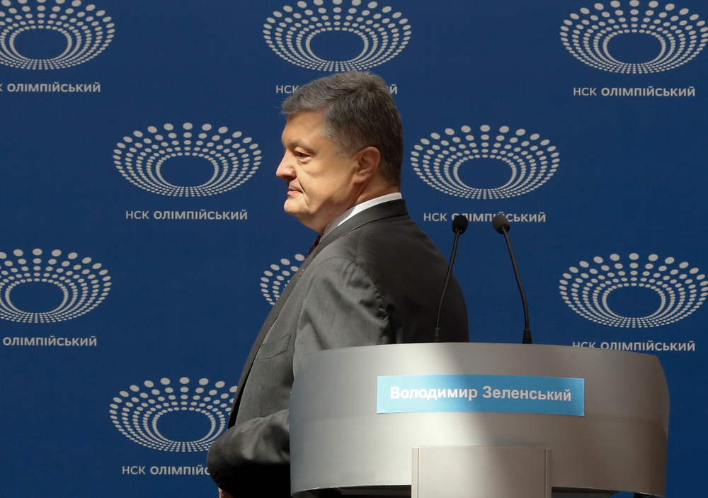 Ukrainian President Petro Poroshenko arrives to deliver his speech ahead of the presidential elections on April 21, at the Olympic stadium in Kiev, Ukraine, Sunday, April 14, 2019. (AP Photo/Efrem Lukatsky) Ukrainian President Petro Poroshenko arrives to deliver his speech ahead of the presidential elections on April 21, at the Olympic stadium in Kiev, Ukraine, Sunday, April 14, 2019. (AP Photo/Efrem Lukatsky)