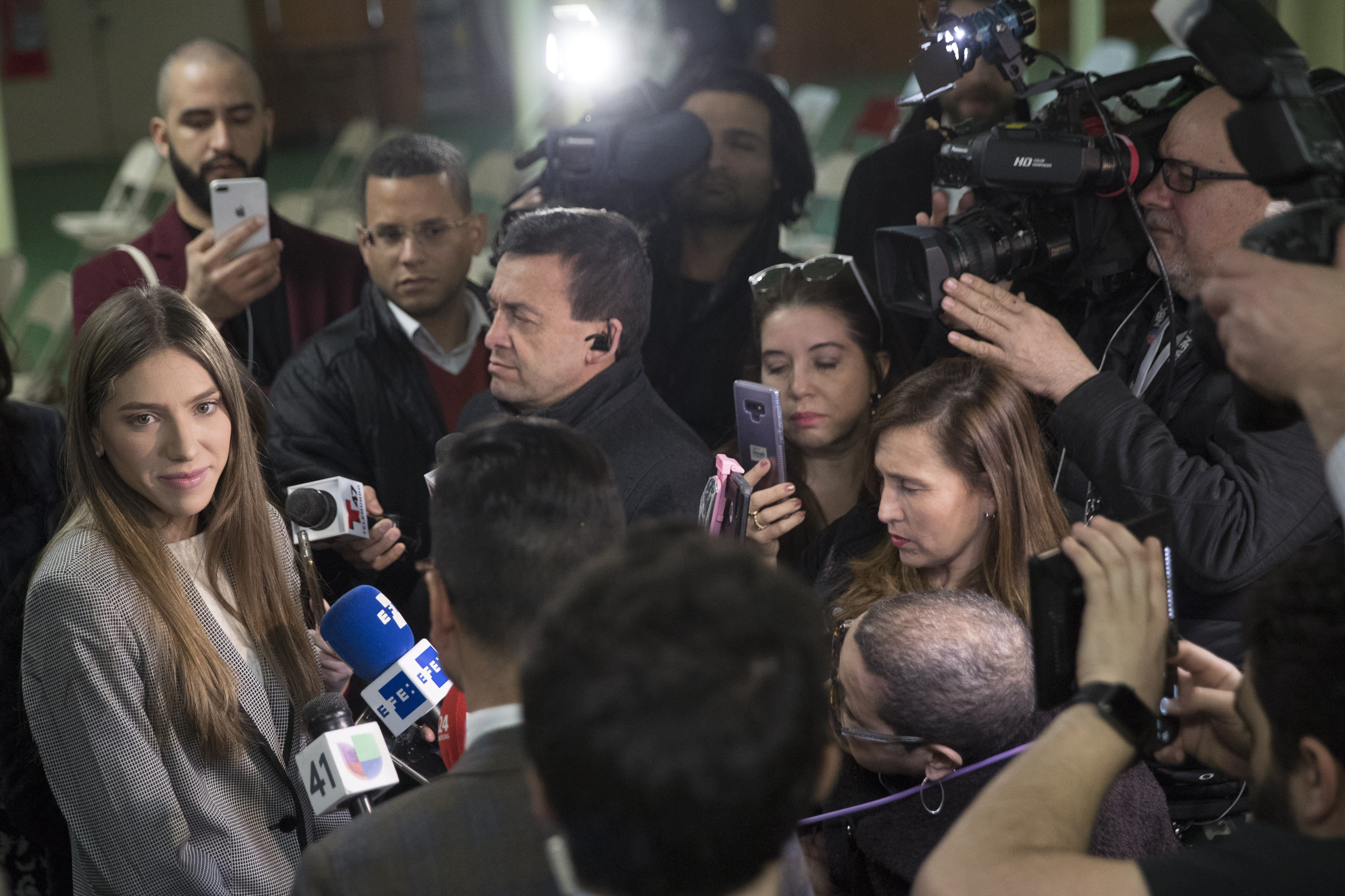 Fabiana Rosales, left, wife of Venezuelan opposition leader Juan Guaido, speaks to reporters before attending Mass at St. Teresa's Church on the Lower East Side of Manhattan, Tuesday, March 26, 2019, in New York. Rosales is emerging as a prominent figure in Guaido's campaign to bring change in the crisis-wracked country. (AP Photo/Mary Altaffer) Fabiana Rosales, left, wife of Venezuelan opposition leader Juan Guaido, speaks to reporters before attending Mass at St. Teresa's Church on the Lower East Side of Manhattan, Tuesday, March 26, 2019, in New York. Rosales is emerging as a prominent figure in Guaido's campaign to bring change in the crisis-wracked country. (AP Photo/Mary Altaffer)