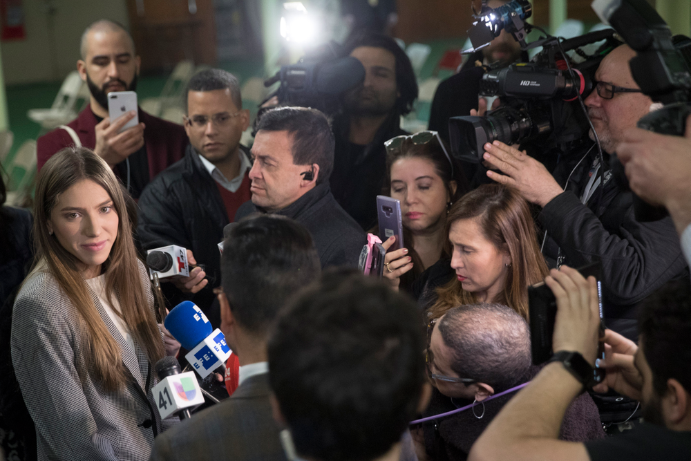 Fabiana Rosales, left, wife of Venezuelan opposition leader Juan Guaido, speaks to reporters before attending Mass at St. Teresa's Church on the Lower East Side of Manhattan, Tuesday, March 26, 2019, in New York. Rosales is emerging as a prominent figure in Guaido's campaign to bring change in the crisis-wracked country. (AP Photo/Mary Altaffer) Fabiana Rosales, left, wife of Venezuelan opposition leader Juan Guaido, speaks to reporters before attending Mass at St. Teresa's Church on the Lower East Side of Manhattan, Tuesday, March 26, 2019, in New York. Rosales is emerging as a prominent figure in Guaido's campaign to bring change in the crisis-wracked country. (AP Photo/Mary Altaffer)