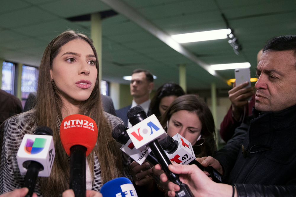 Fabiana Rosales, left, wife of Venezuelan opposition leader Juan Guaido, speaks to reporters before attending Mass at St. Teresa's Church on the Lower East Side of Manhattan, Tuesday, March 26, 2019, in New York. Rosales is emerging as a prominent figure in Guaido's campaign to bring change in the crisis-wracked country. (AP Photo/Mary Altaffer) Fabiana Rosales, left, wife of Venezuelan opposition leader Juan Guaido, speaks to reporters before attending Mass at St. Teresa's Church on the Lower East Side of Manhattan, Tuesday, March 26, 2019, in New York. Rosales is emerging as a prominent figure in Guaido's campaign to bring change in the crisis-wracked country. (AP Photo/Mary Altaffer)