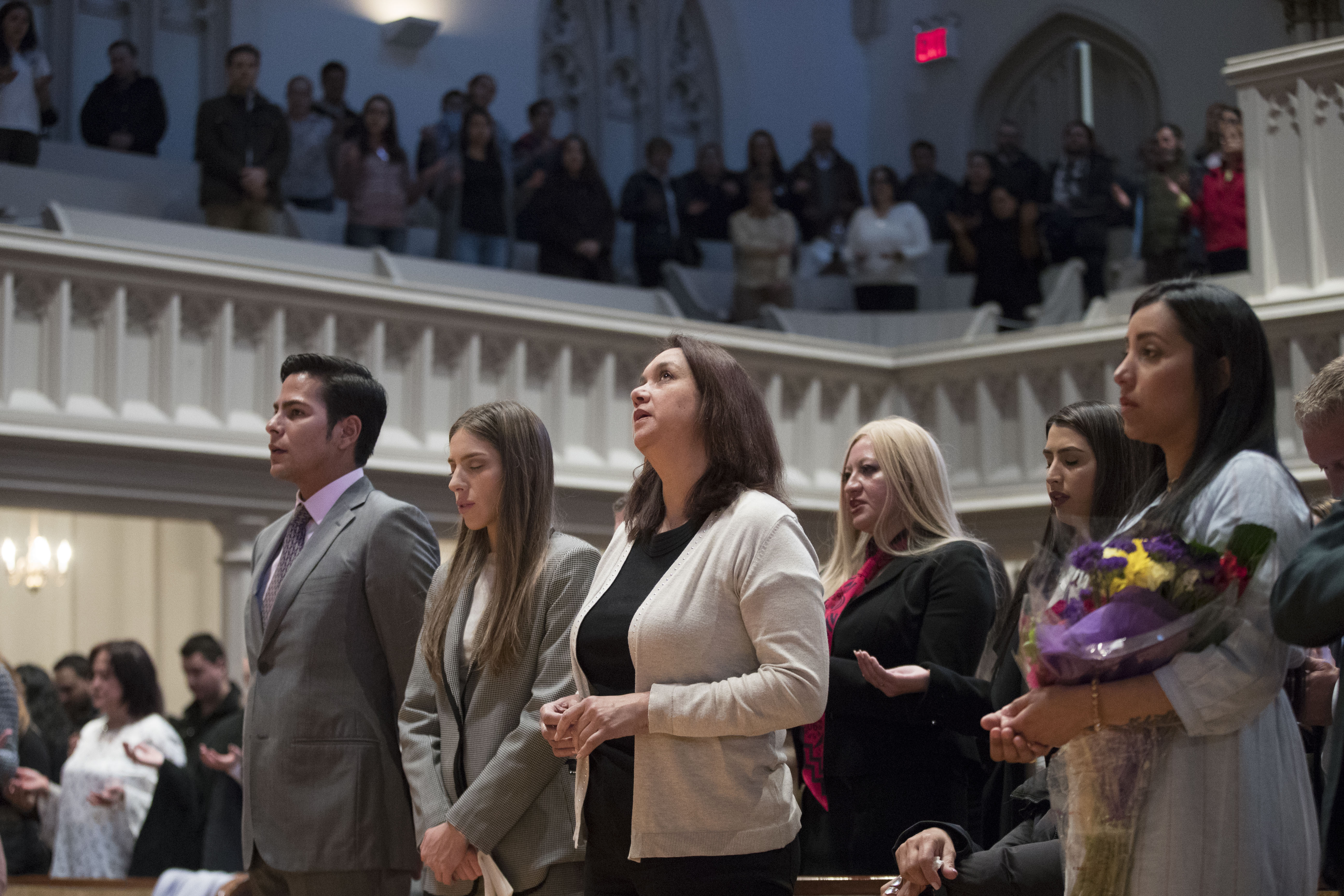 Fabiana Rosales, second from left, wife of Venezuelan opposition leader Juan Guaido, celebrates Mass with Guaido supporter and activist Erick Rozo, left, at St. Teresa's Church on the Lower East Side of Manhattan, Tuesday, March 26, 2019, in New York. Rosales is emerging as a prominent figure in Guaido's campaign to bring change in the crisis-wracked country. (AP Photo/Mary Altaffer) Fabiana Rosales, second from left, wife of Venezuelan opposition leader Juan Guaido, celebrates Mass with Guaido supporter and activist Erick Rozo, left, at St. Teresa's Church on the Lower East Side of Manhattan, Tuesday, March 26, 2019, in New York. Rosales is emerging as a prominent figure in Guaido's campaign to bring change in the crisis-wracked country. (AP Photo/Mary Altaffer)