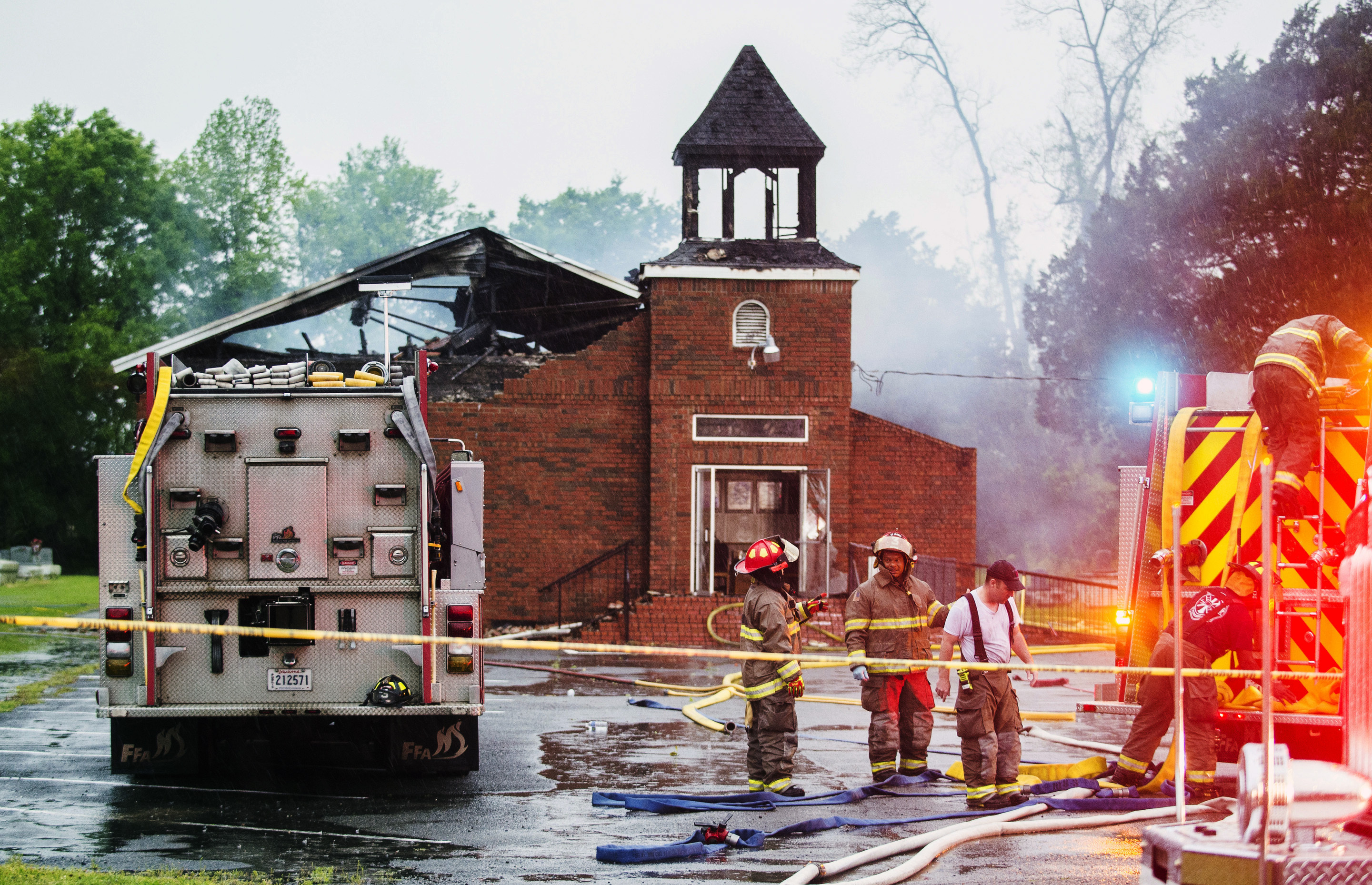 FILE - In this April 4, 2019 file photo, firefighters and fire investigators respond to a fire at Mt. Pleasant Baptist Church, in Opelousas, La. Authorities have arrested a person in connection with suspicious fires at three historic black churches in southern Louisiana, a federal prosecutor said. The suspect was in state custody, U.S. Attorney David C. Joseph announced late Wednesday, April 10 in a news release labeling the fires “despicable acts.” (Leslie Westbrook/The Advocate via AP, File) FILE - In this April 4, 2019 file photo, firefighters and fire investigators respond to a fire at Mt. Pleasant Baptist Church, in Opelousas, La. Authorities have arrested a person in connection with suspicious fires at three historic black churches in southern Louisiana, a federal prosecutor said. The suspect was in state custody, U.S. Attorney David C. Joseph announced late Wednesday, April 10 in a news release labeling the fires “despicable acts.” (Leslie Westbrook/The Advocate via AP, File)