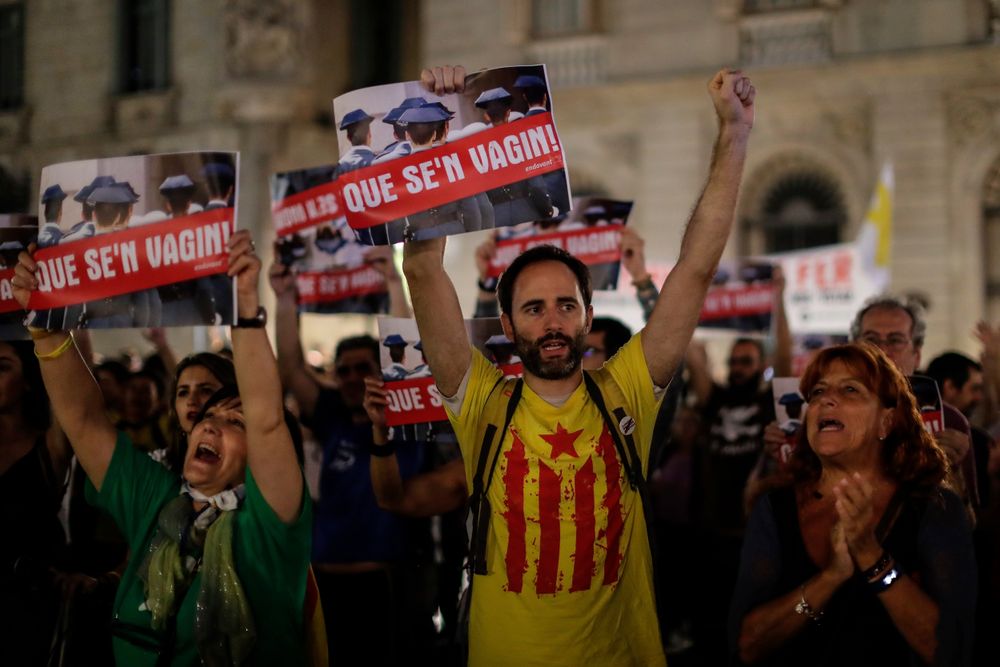 CORRECTS PHOTOGRAPHER NAME - People protest against the detention of seven Catalan independence supporters during a demonstration in Sant Jaume square, Barcelona, Spain, Thursday, Sept. 26, 2019. Spain's National Court says a judge is sending to jail seven Catalan independence supporters who were arrested this week for allegedly planning violent acts, possibly with explosives. A court statement says an investigating judge has found signs that the seven could be part of an organization that intends to use CORRECTS PHOTOGRAPHER NAME - People protest against the detention of seven Catalan independence supporters during a demonstration in Sant Jaume square, Barcelona, Spain, Thursday, Sept. 26, 2019. Spain's National Court says a judge is sending to jail seven Catalan independence supporters who were arrested this week for allegedly planning violent acts, possibly with explosives. A court statement says an investigating judge has found signs that the seven could be part of an organization that intends to use