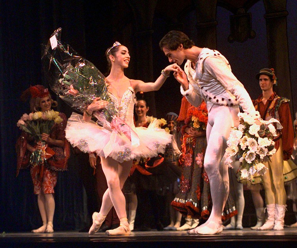 FILE - This Jan. 27, 1998 file photo shows Oscar Torrado kissing ballerina Lorna Feijoo on the hand during a curtain call following Ballet Nacional de Cuba's performance of FILE - This Jan. 27, 1998 file photo shows Oscar Torrado kissing ballerina Lorna Feijoo on the hand during a curtain call following Ballet Nacional de Cuba's performance of